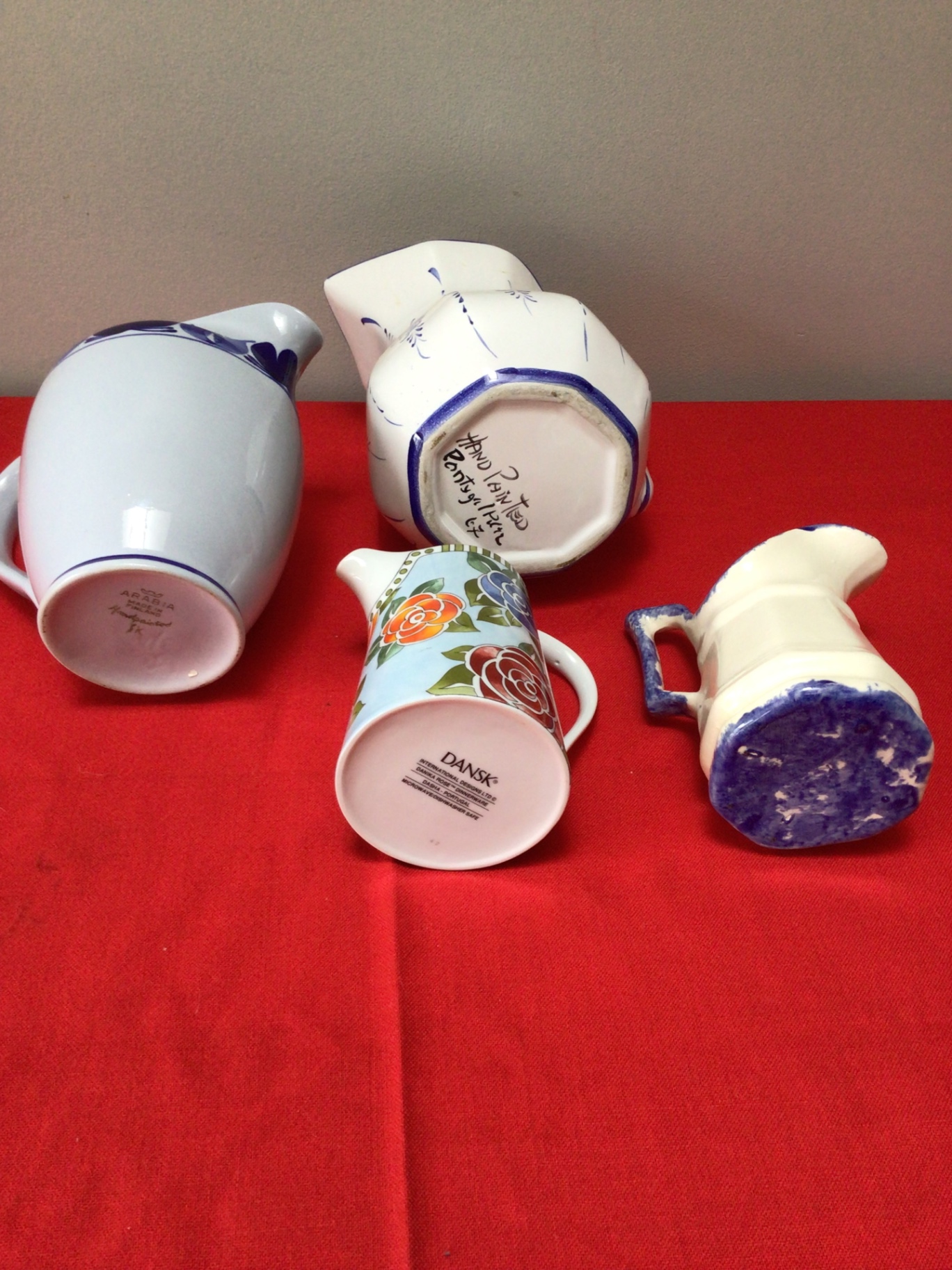 Assorted ceramic pitchers and a floral mug - image 3 of 3