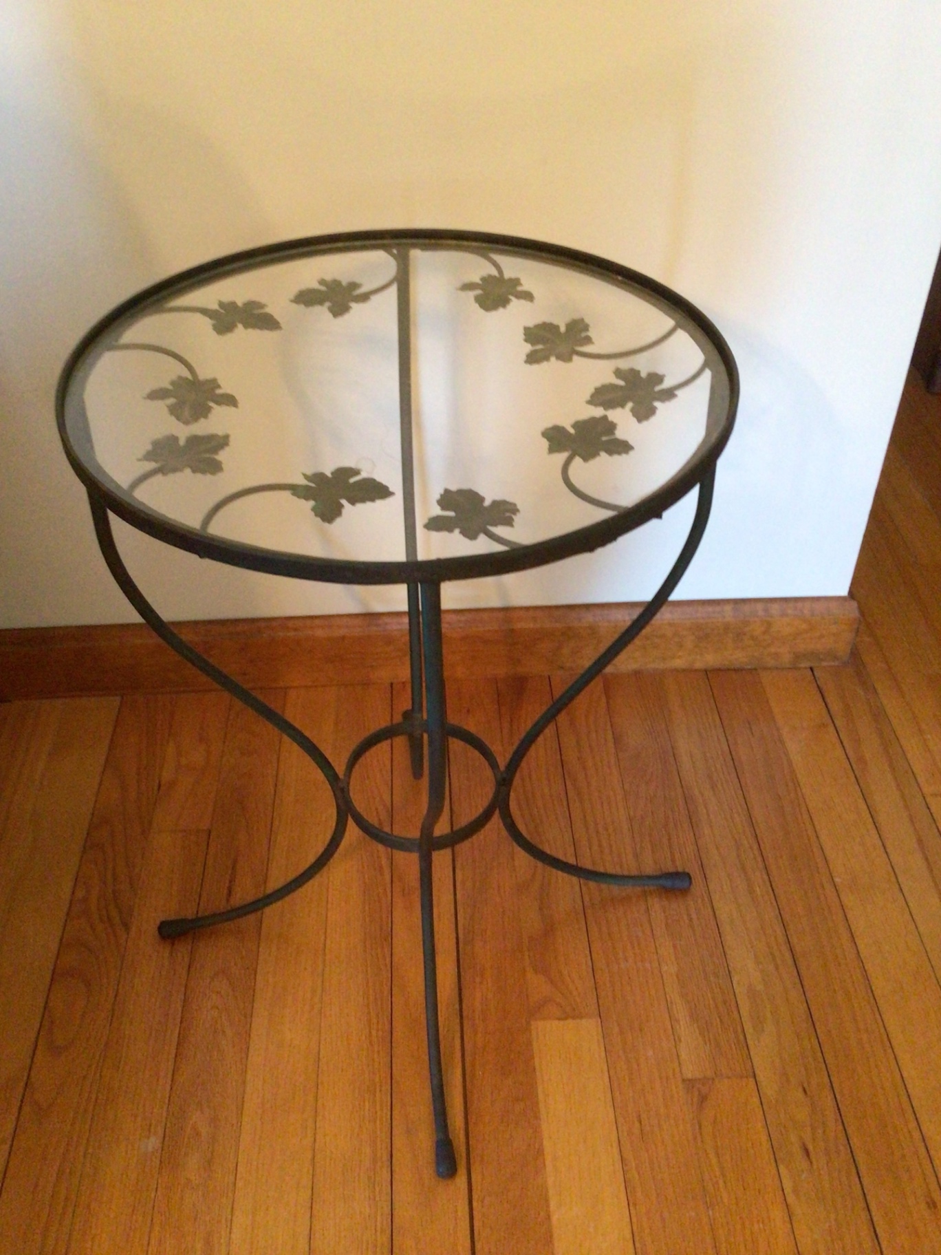 Round glass-top metal end table with ivy leaf motif - image 2 of 2