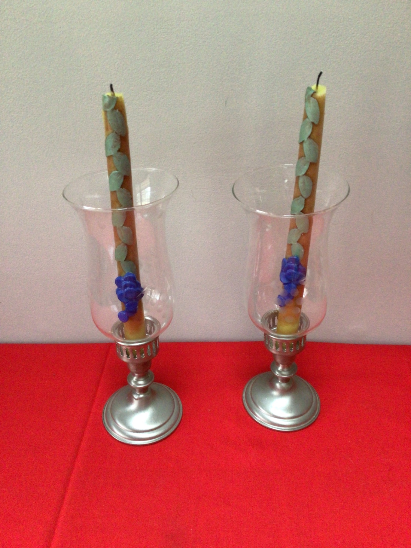 WHH pewter Pair of glass hurricane candle holders with decorative pillar candles - image 1 of 3