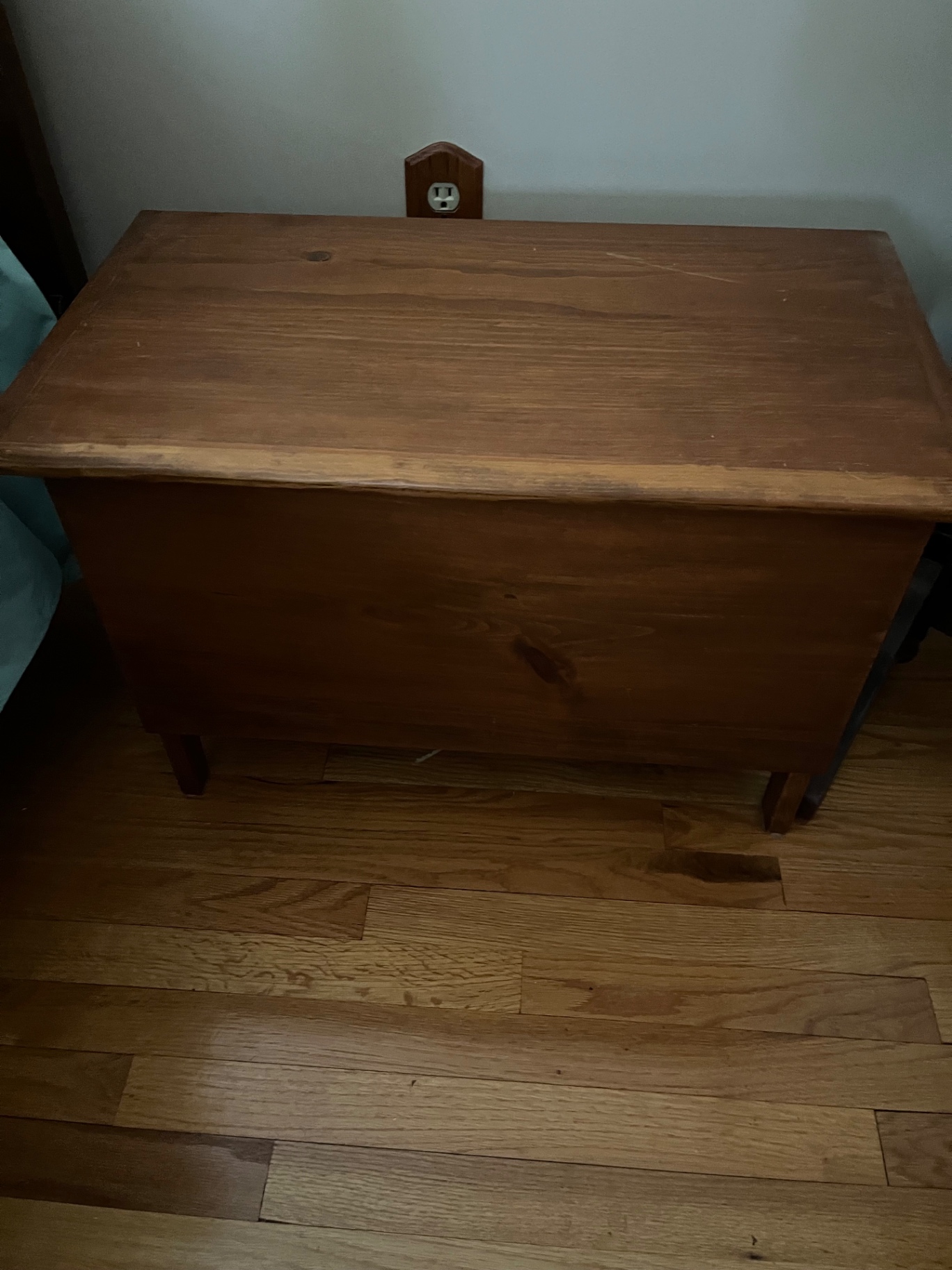 Wooden storage chest with folded linens - image 1 of 2