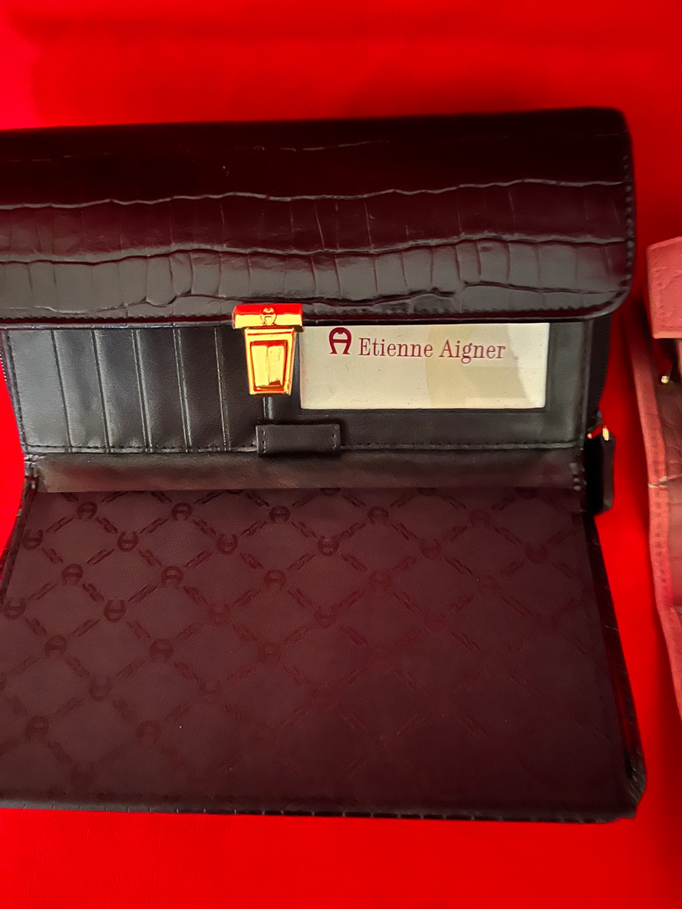 Etienne Aigner black wallet and Buxton pink crocodile-embossed wallet - image 1 of 3