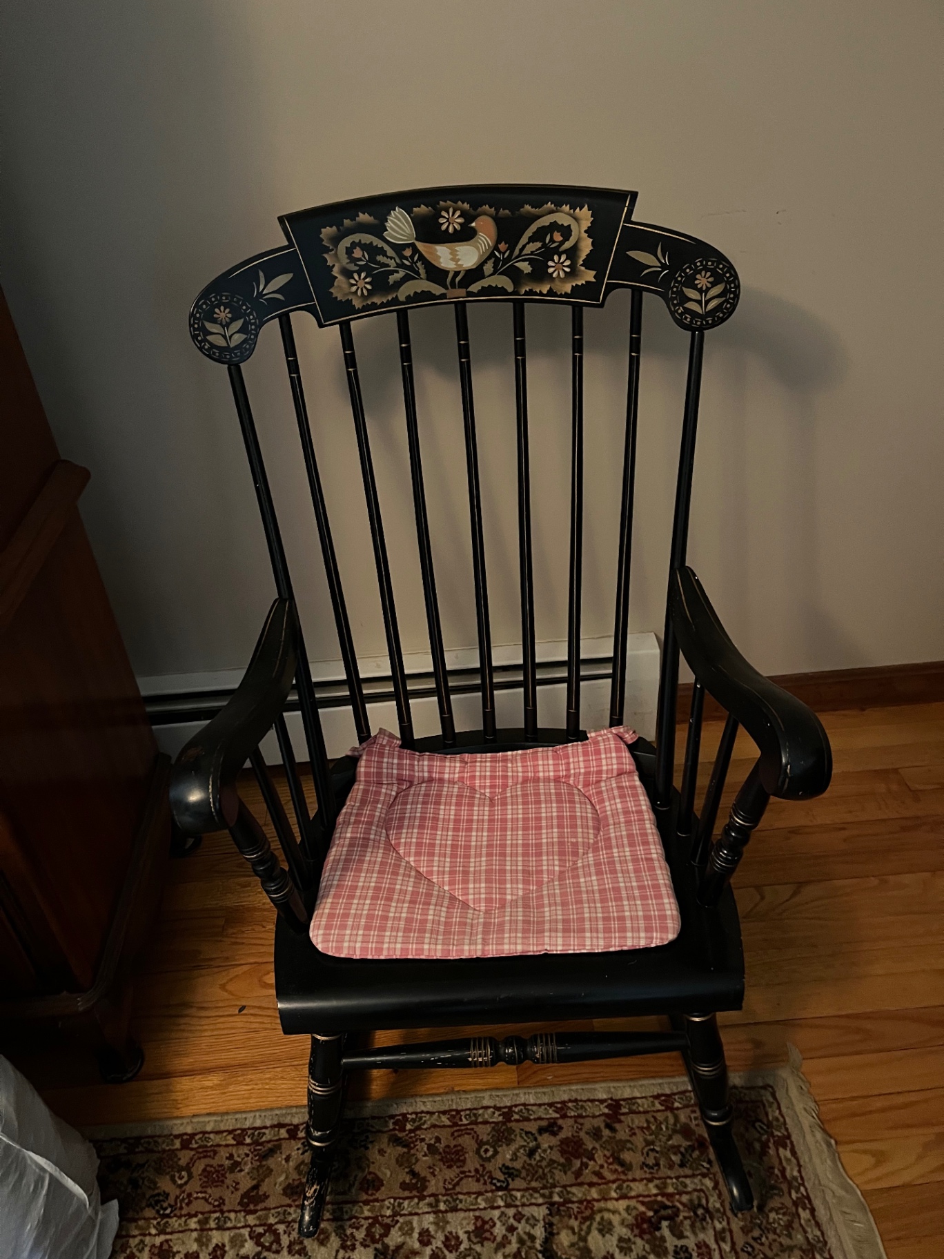 Black wooden rocking chair with heart-shaped plaid cushion - image 1 of 2