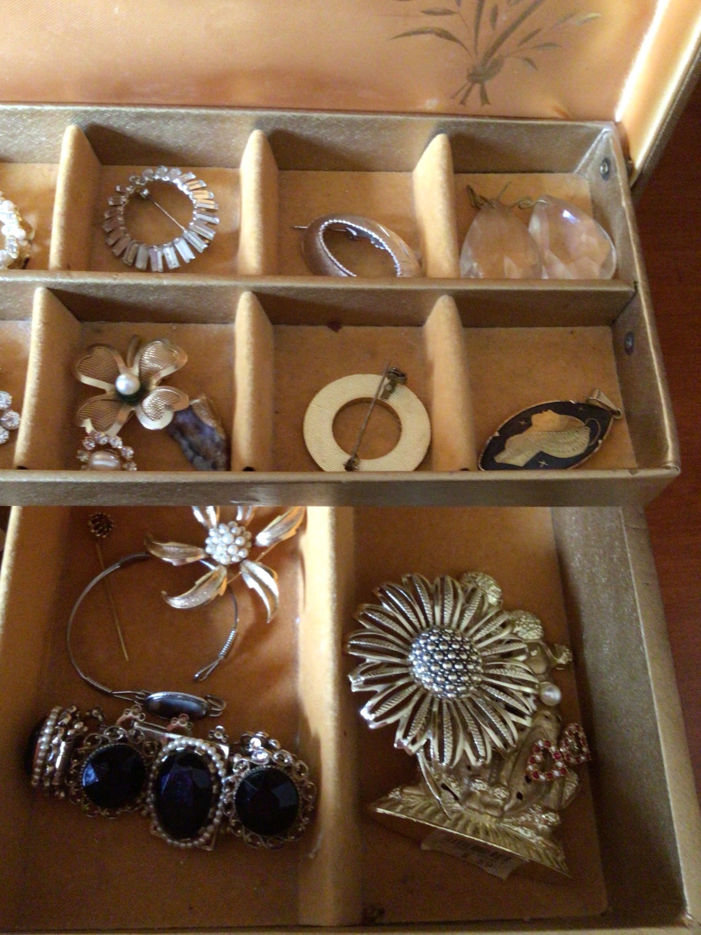 Assorted jewelry in a compartmentalized storage box - image 3 of 4