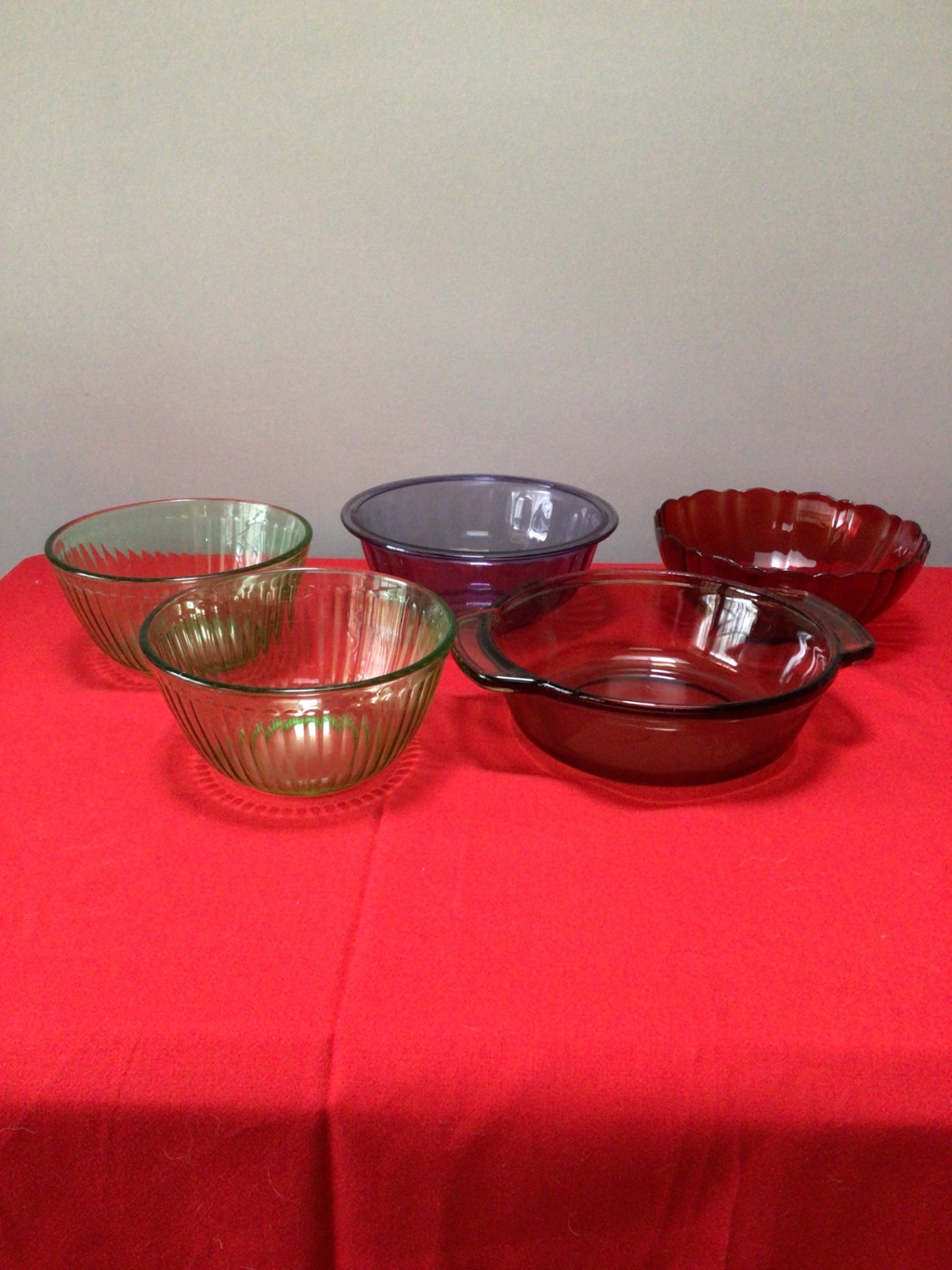 Set of Pyrex glass bowls and red casserole dish - image 1 of 5