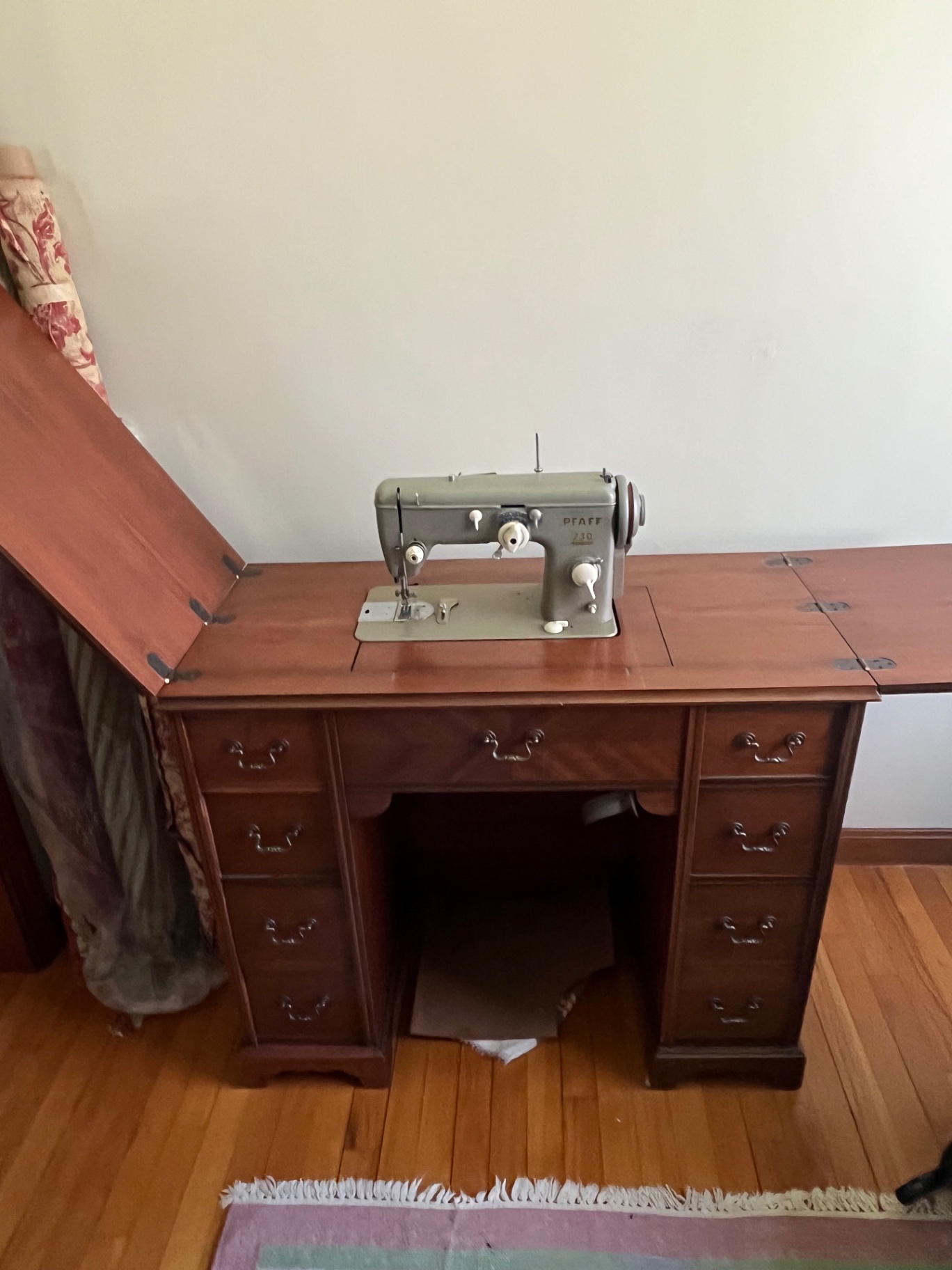 Vintage Pfaff 230 sewing machine on wooden desk - image 1 of 2