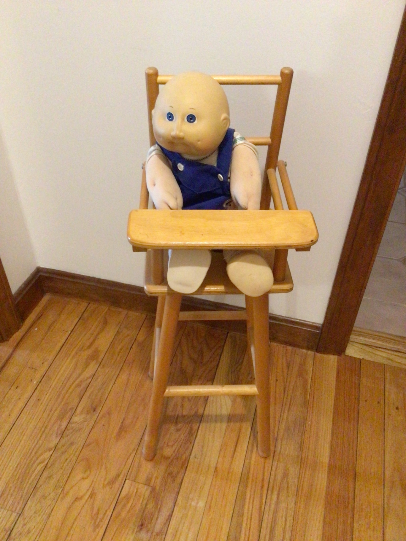Wooden high chair with a doll - image 1 of 2