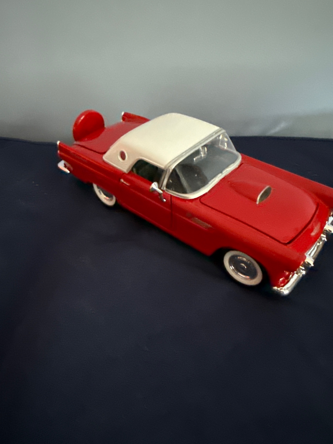 Red and white vintage die-cast toy cars: a convertible and a VW-style bus - image 2 of 5