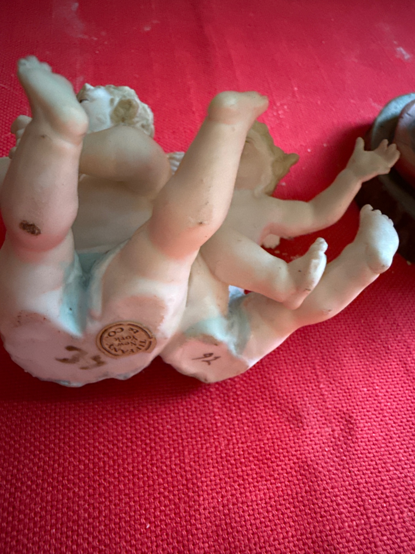 Religious figurine group: hand sculpture cradling a baby and a Tiffany cherub - image 3 of 4