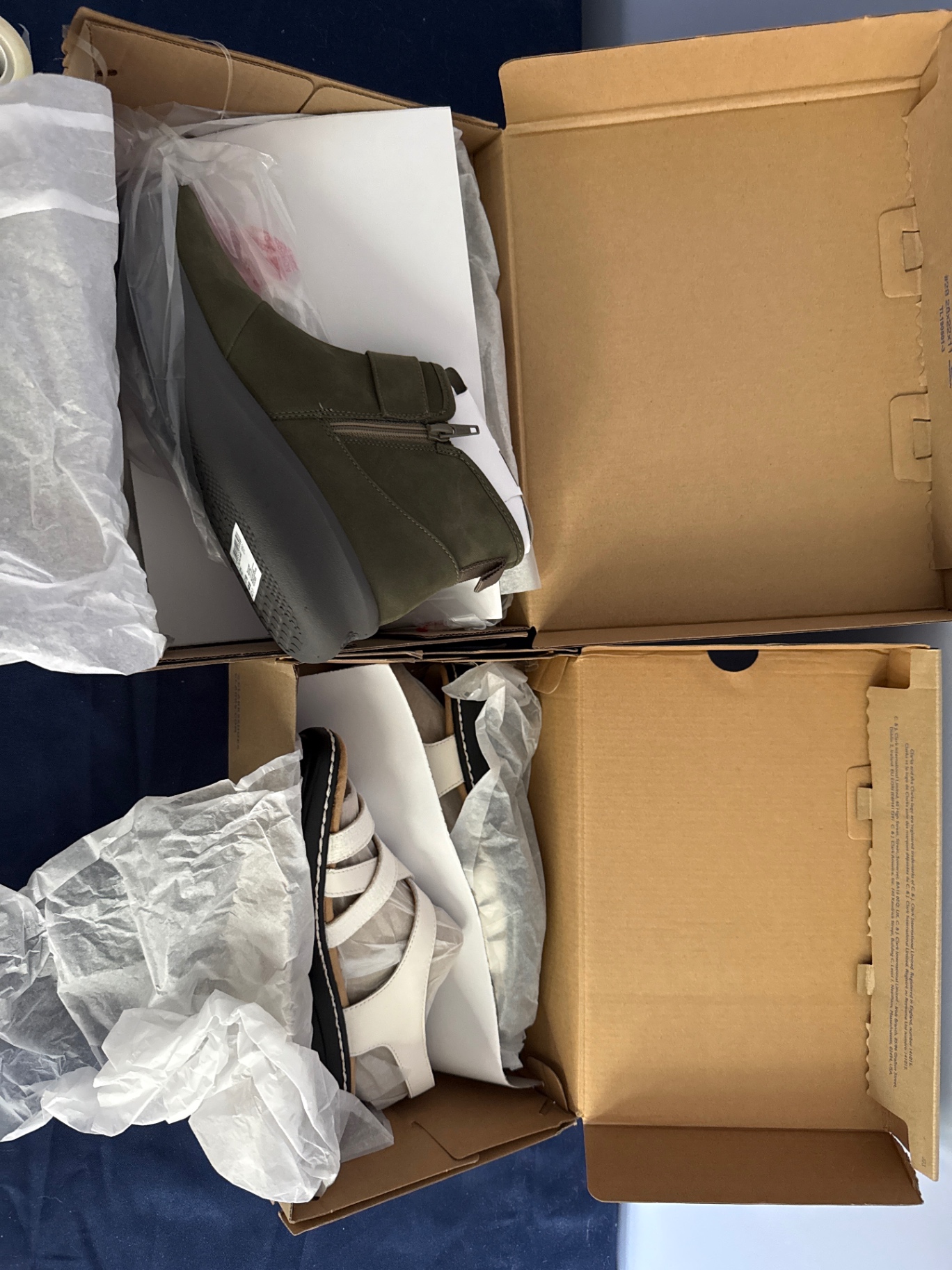 Olive-green ankle boot and white strappy sandal with Clarks Cloudsteppers boxes - image 1 of 4
