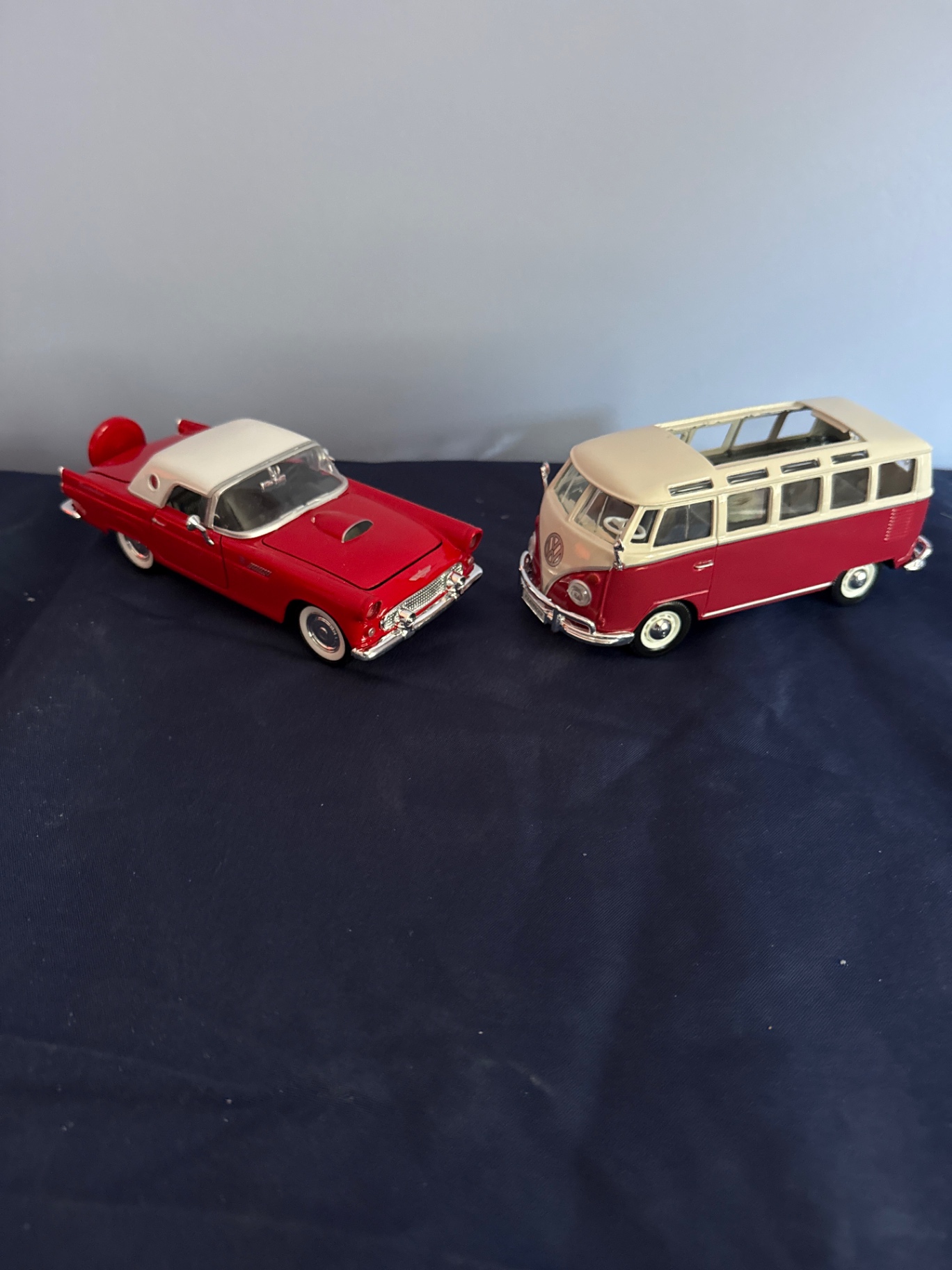 Red and white vintage die-cast toy cars: a convertible and a VW-style bus - image 1 of 5