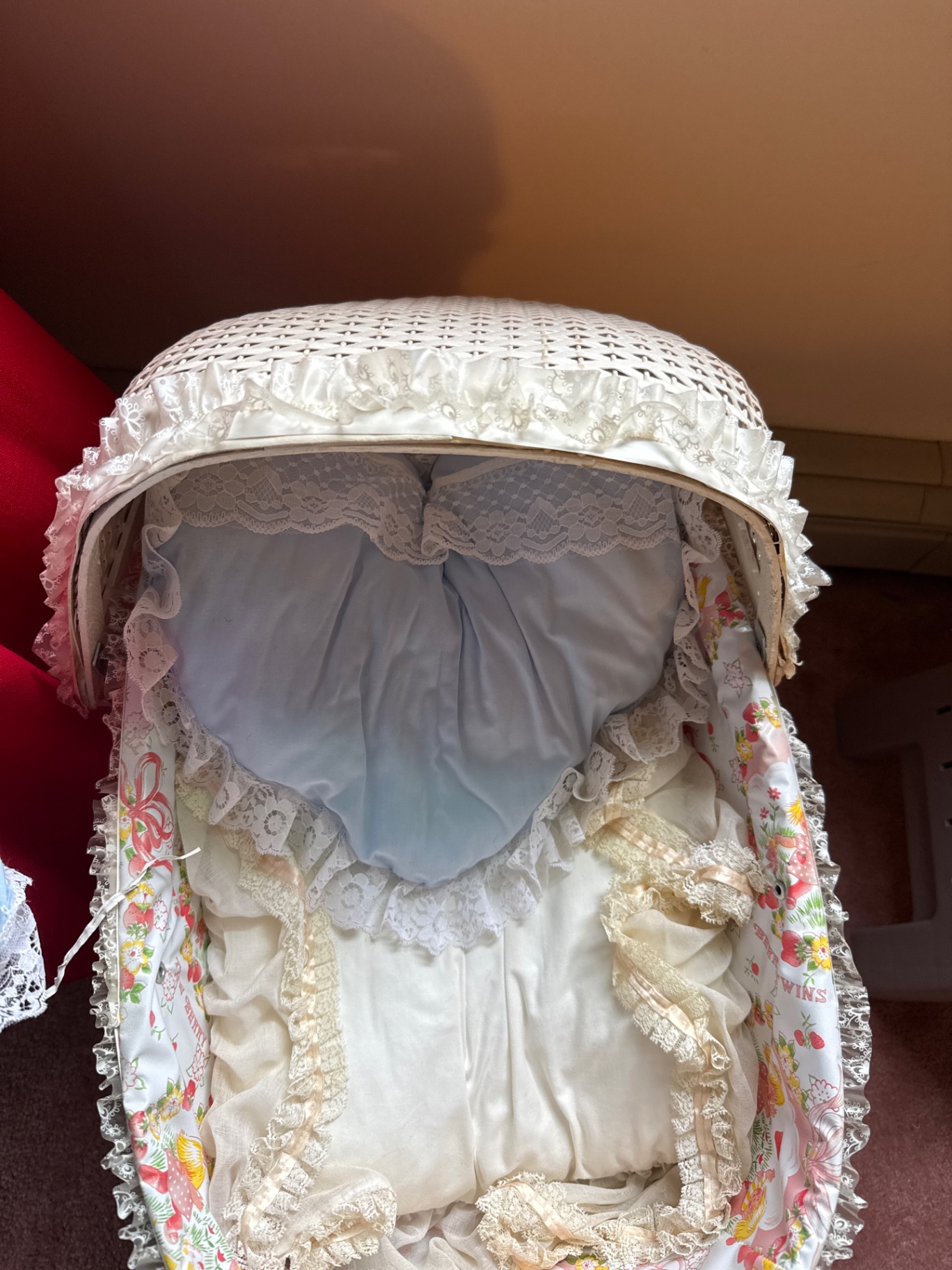 Porcelain baby doll in blue lace-trimmed gown in wicker cradle - image 5 of 6