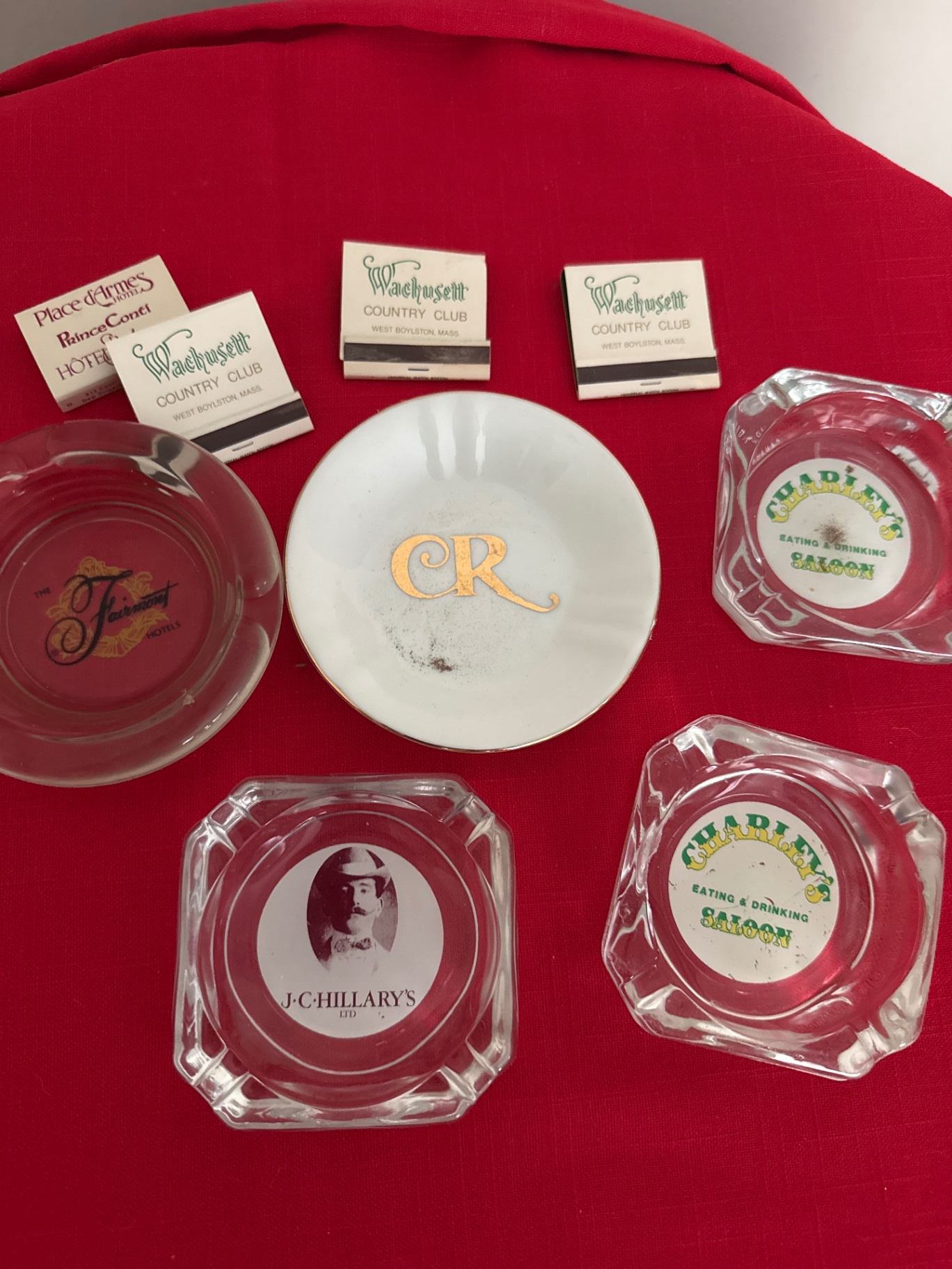 Assorted branded ashtrays and matches  - image 1 of 1