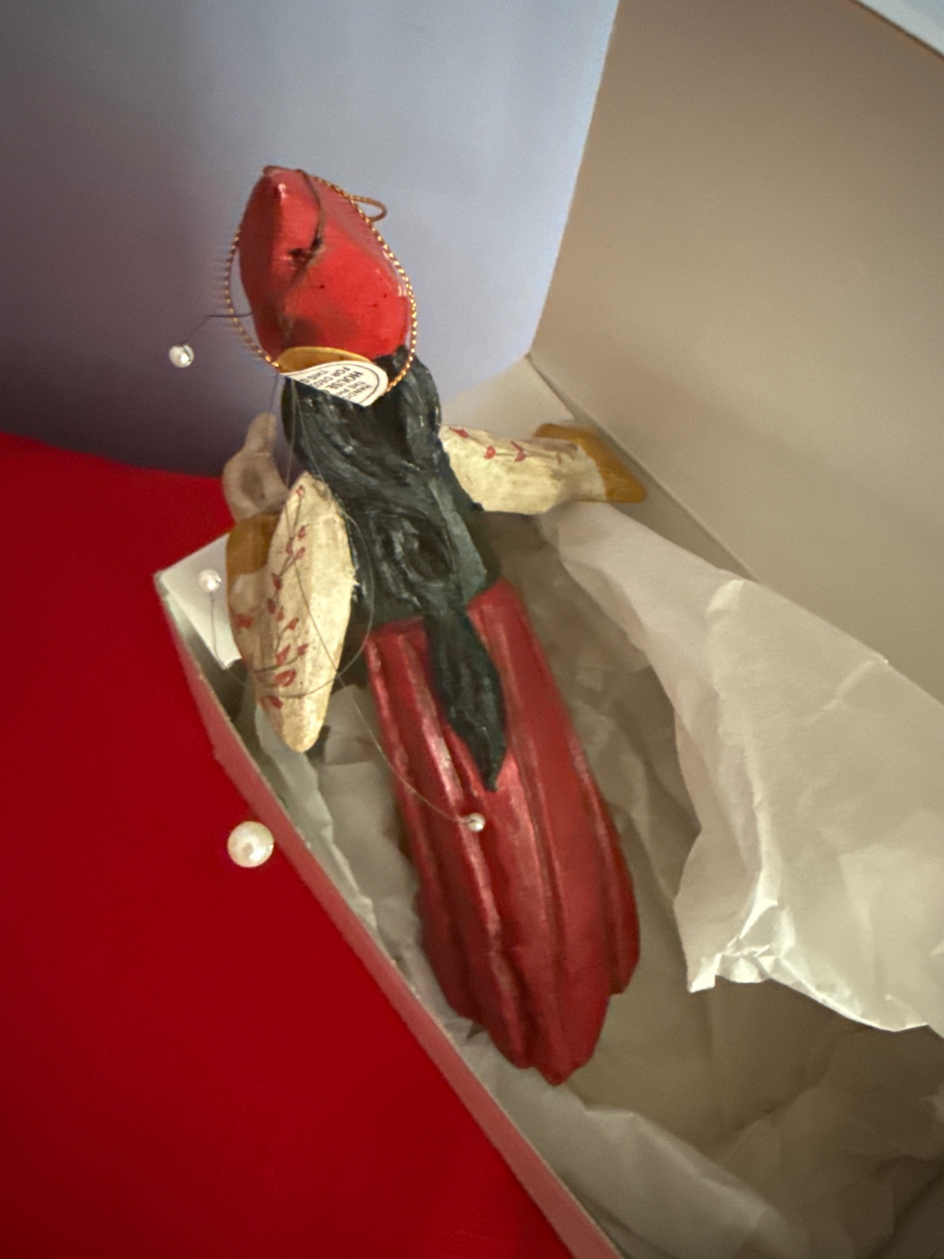 Hand-painted wooden folk-art figurine of a woman in a red dress with wings - image 2 of 4