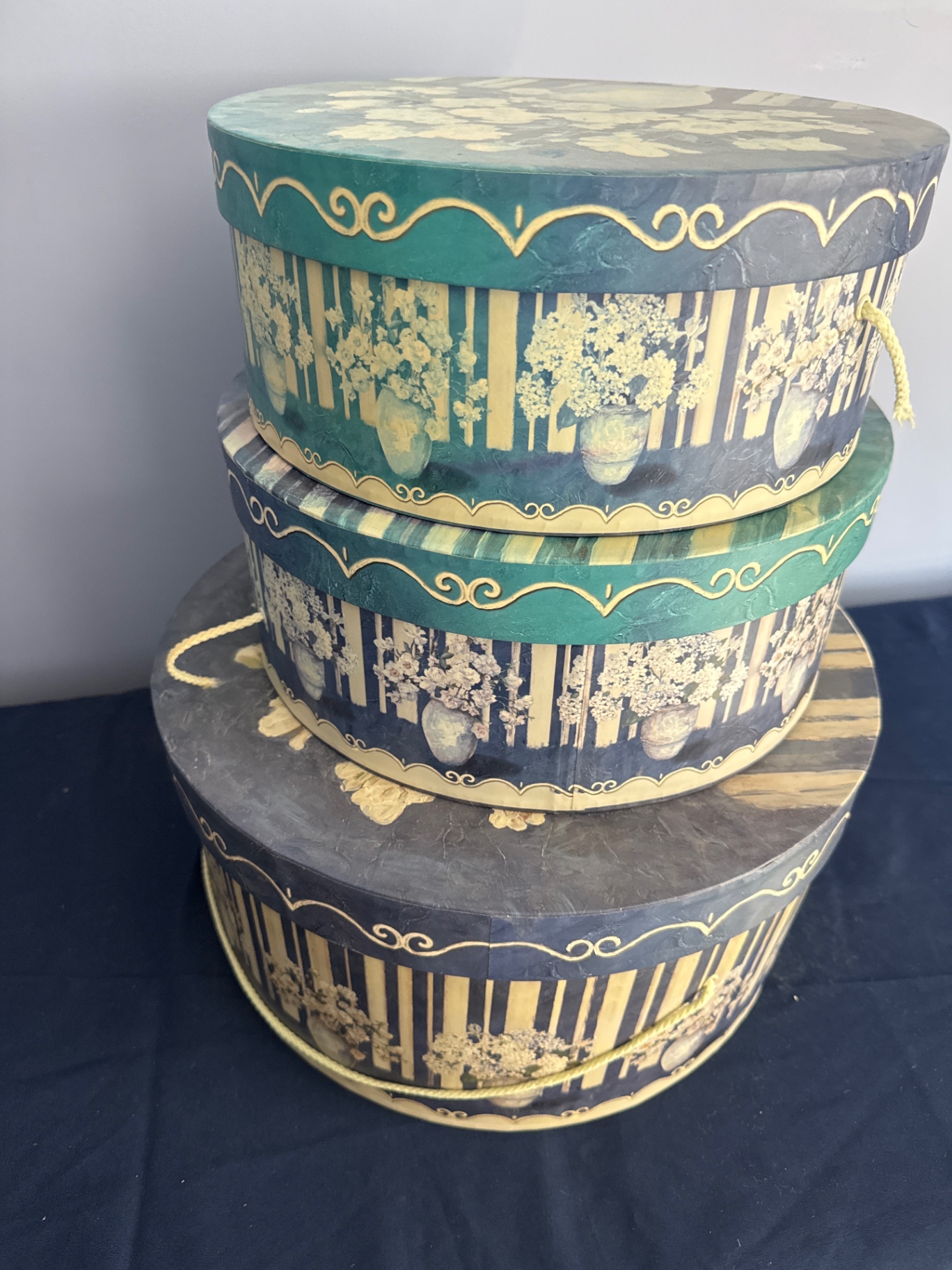 Stack of decorative round hat boxes with teal and gold patterns - image 2 of 2