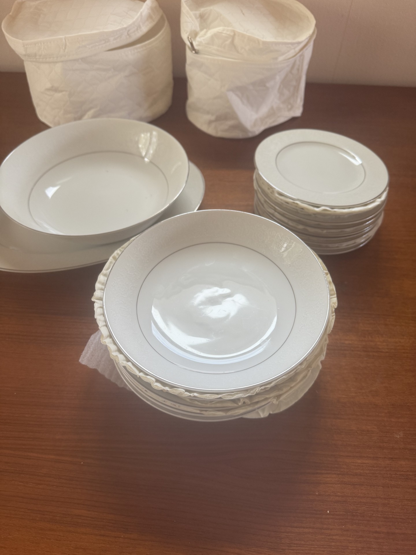 White porcelain dinnerware set with plates, bowls, and saucers - image 1 of 4