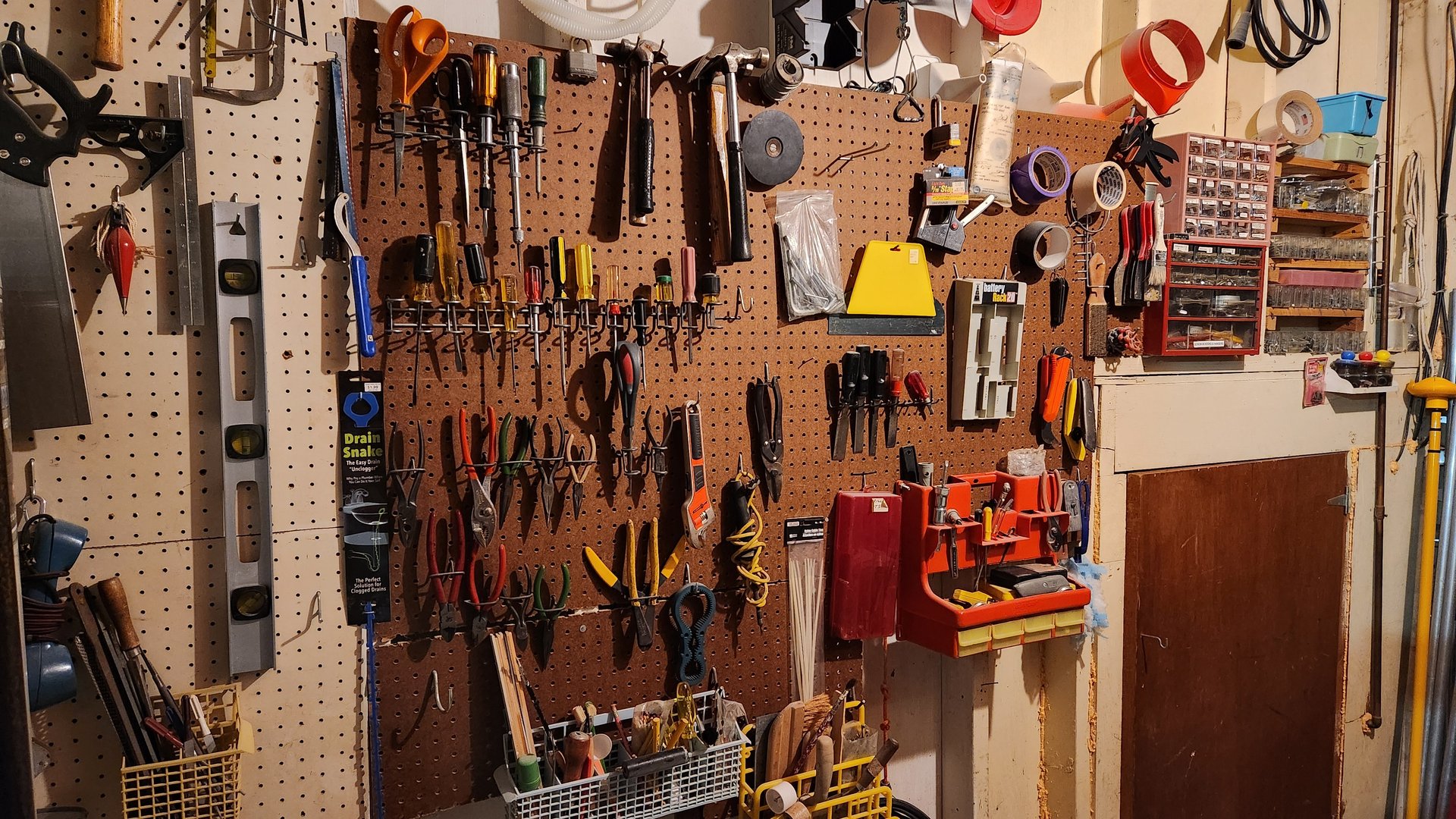 Pegboard workshop with tools and hardware - image 1 of 9