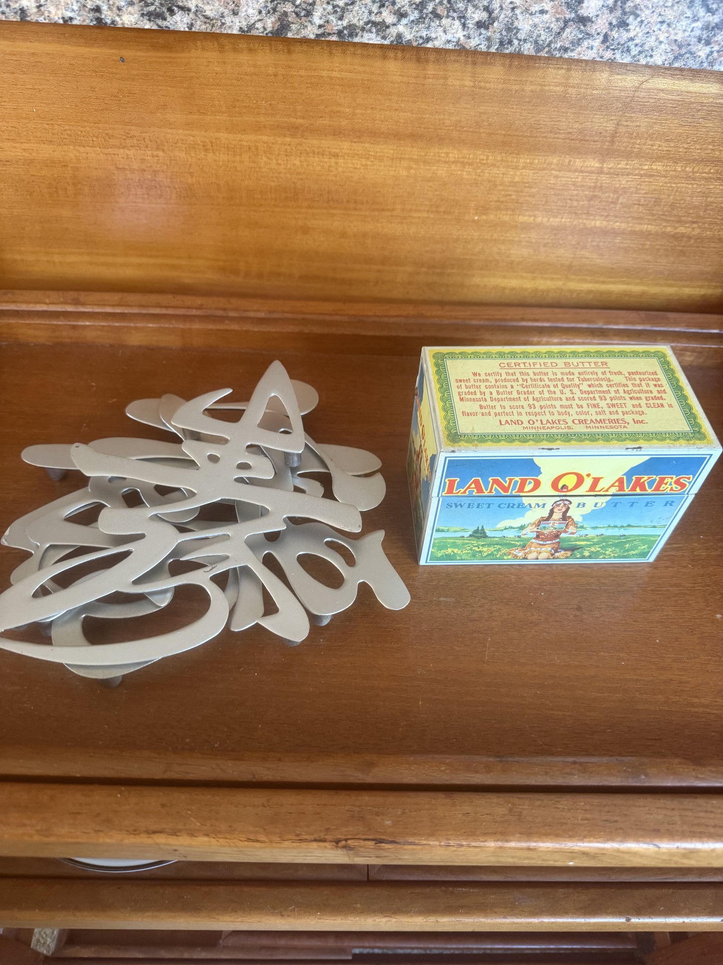 Hot plate trivets and Land O Lakes butter box - image 1 of 9