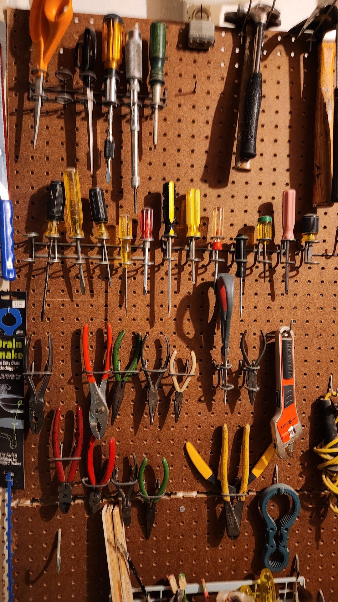 Pegboard workshop with tools and hardware - image 2 of 9
