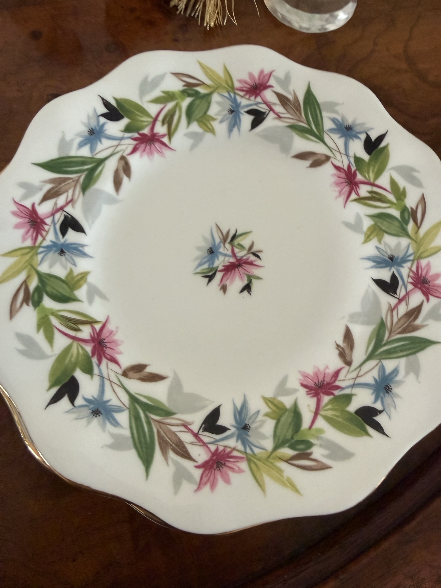 Bone china plates with crystal glassware and decorative figurines - image 4 of 6