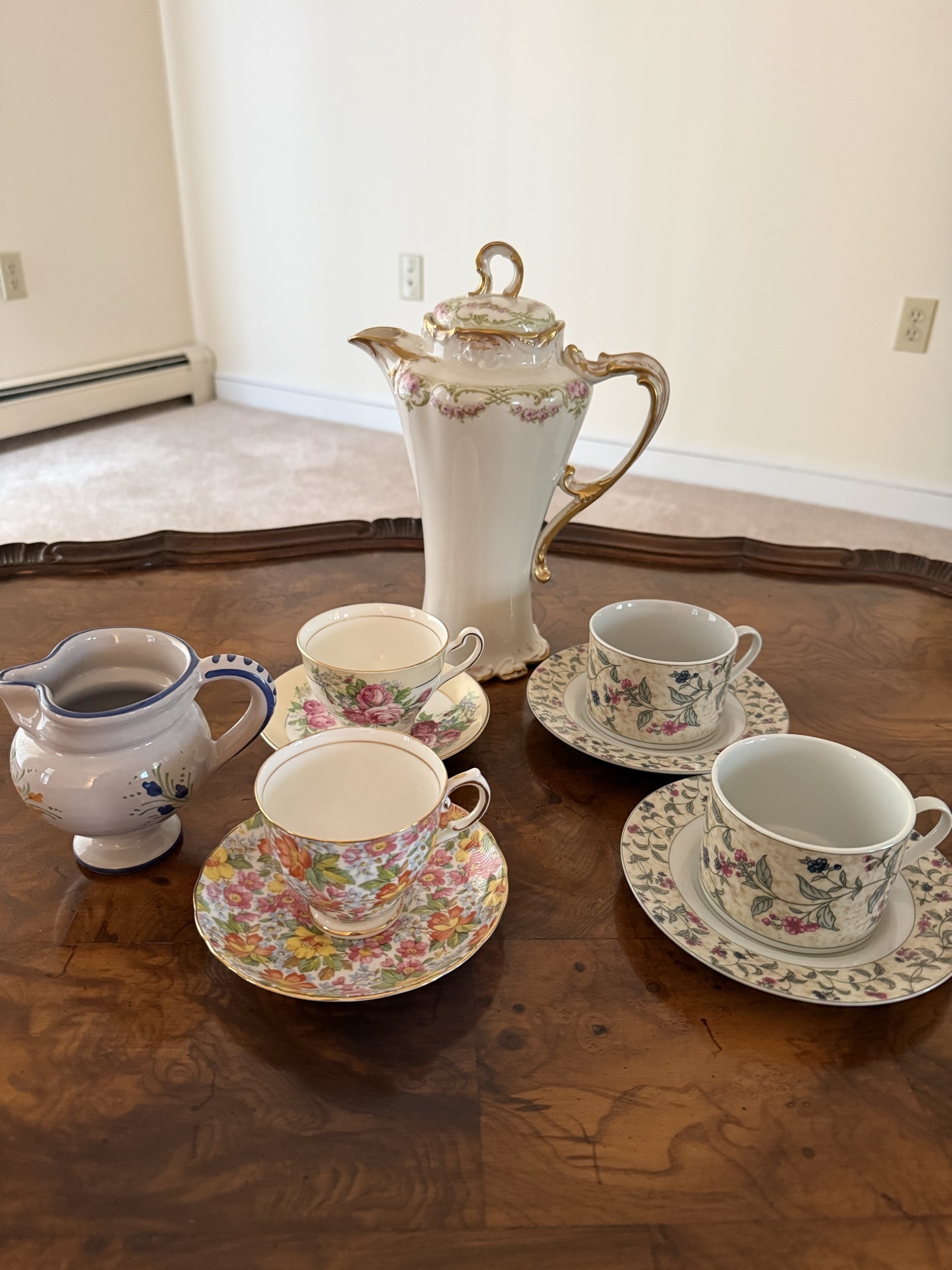 Floral porcelain tea set with teapot, creamer, and cups - image 1 of 10