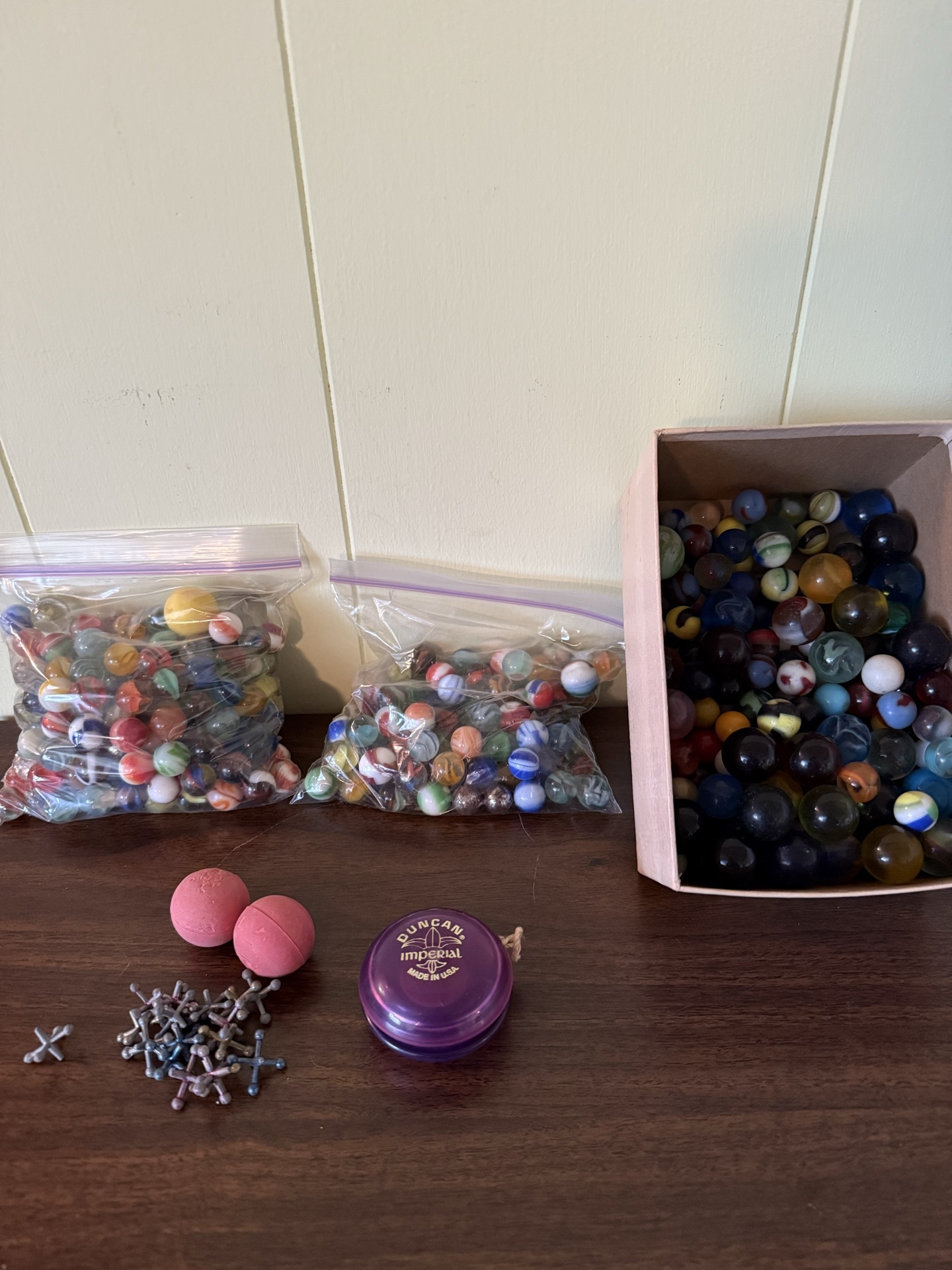 Assorted marbles and a Duncan Imperial yo-yo - image 1 of 6