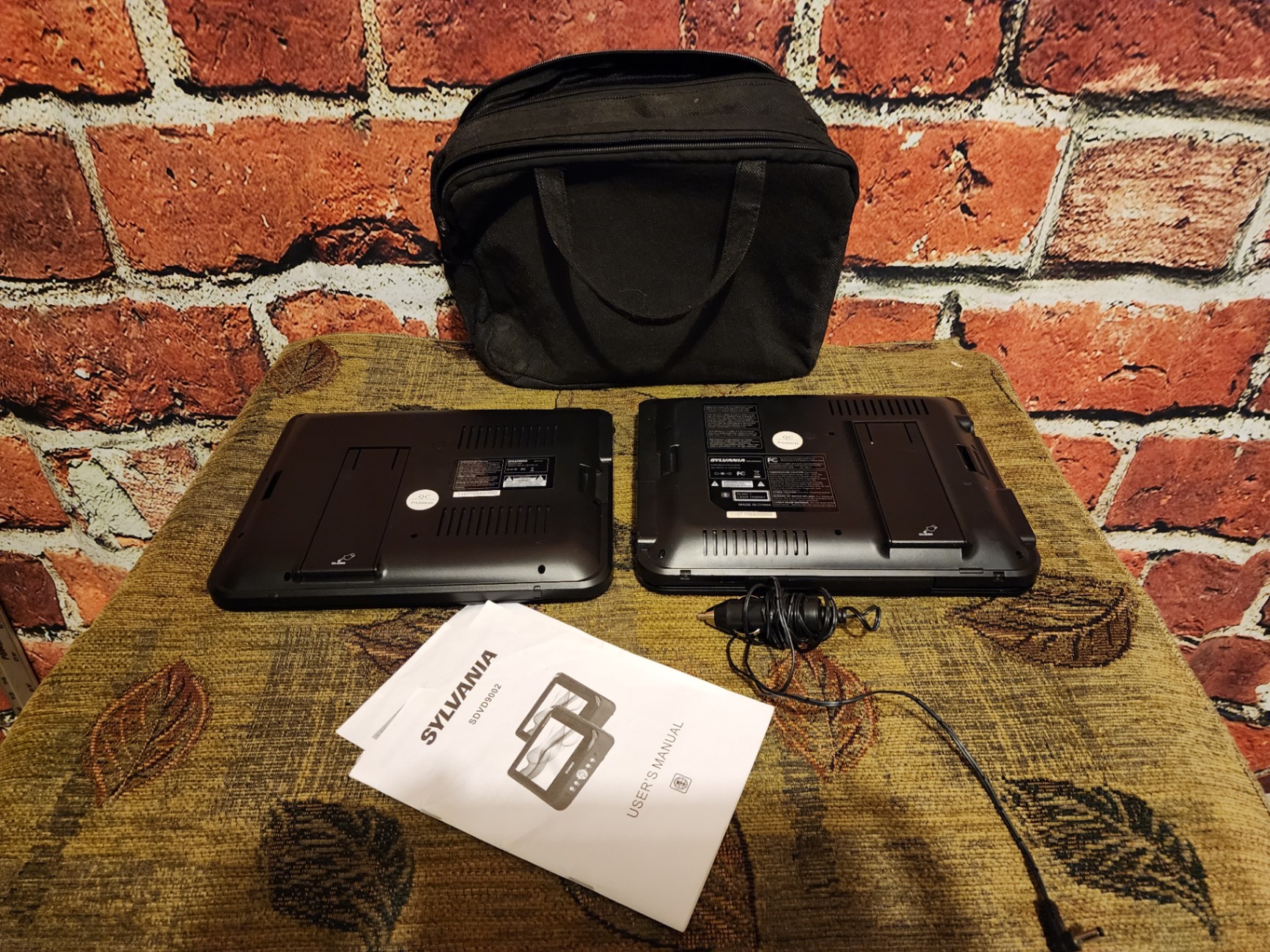 Two Sylvania portable DVD players with power adapter and manual - image 4 of 7