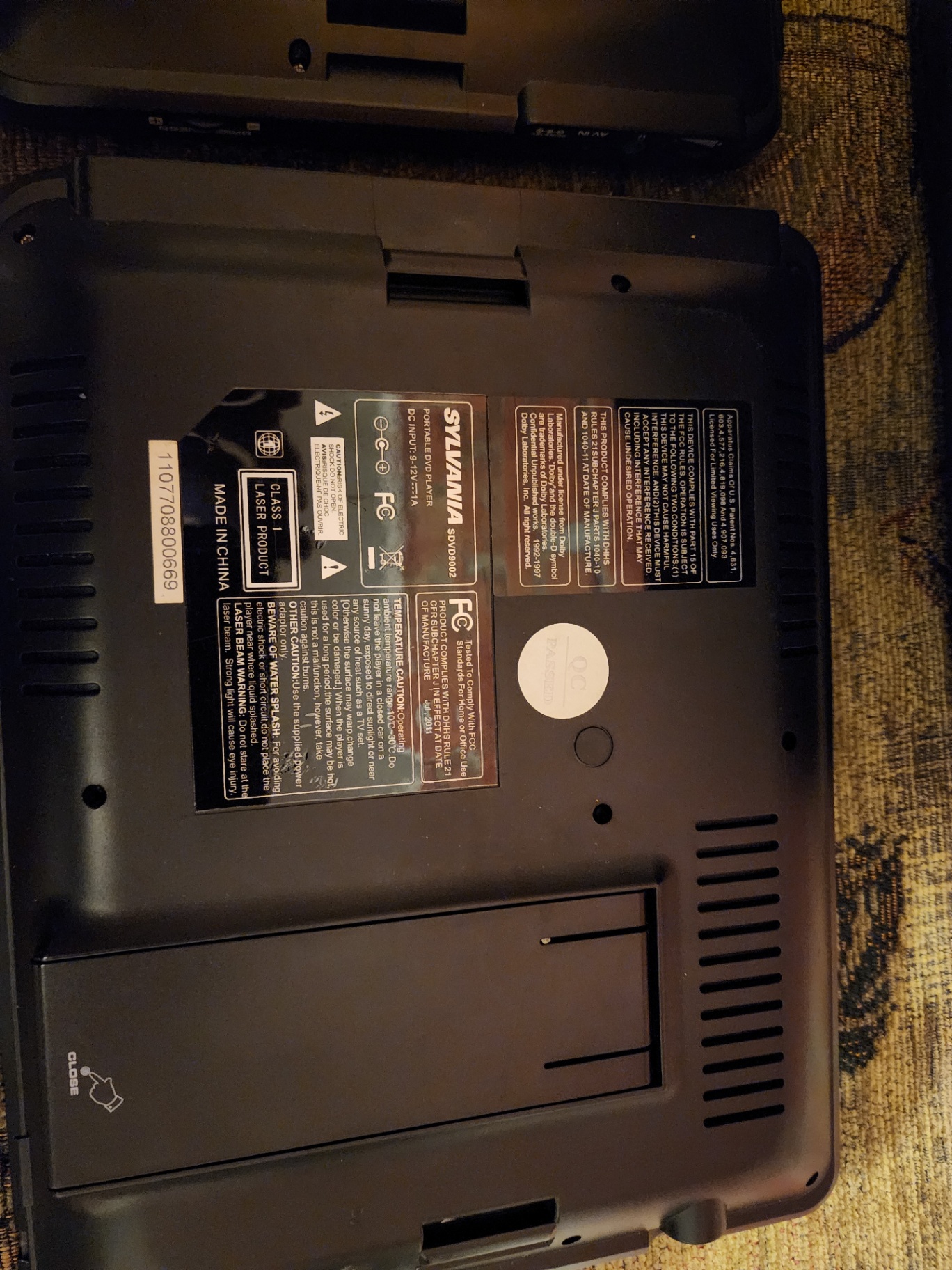 Two Sylvania portable DVD players with power adapter and manual - image 3 of 7