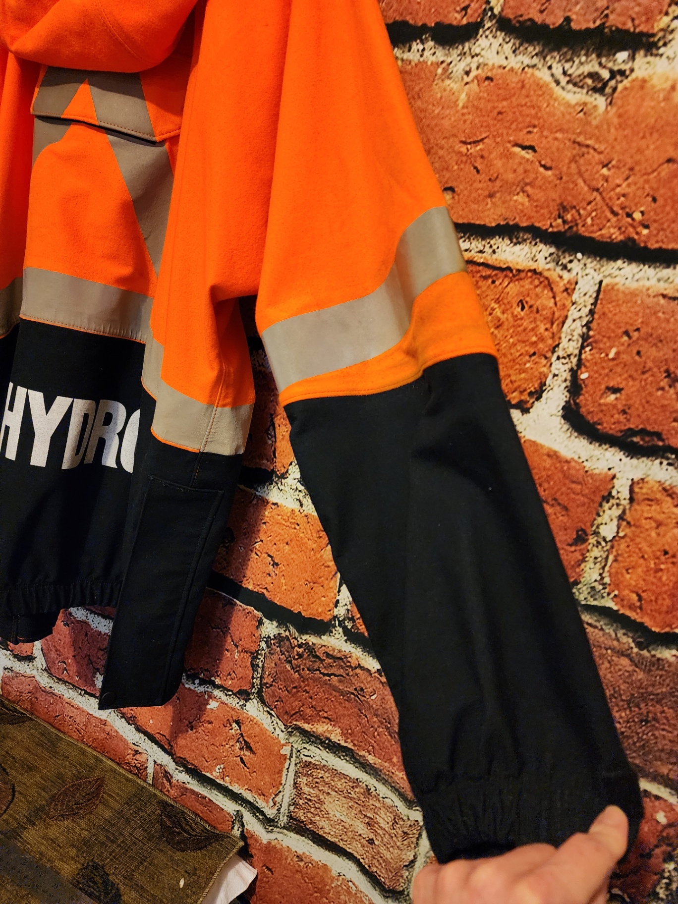 Orange high-visibility safety jacket with reflective stripes - image 2 of 9