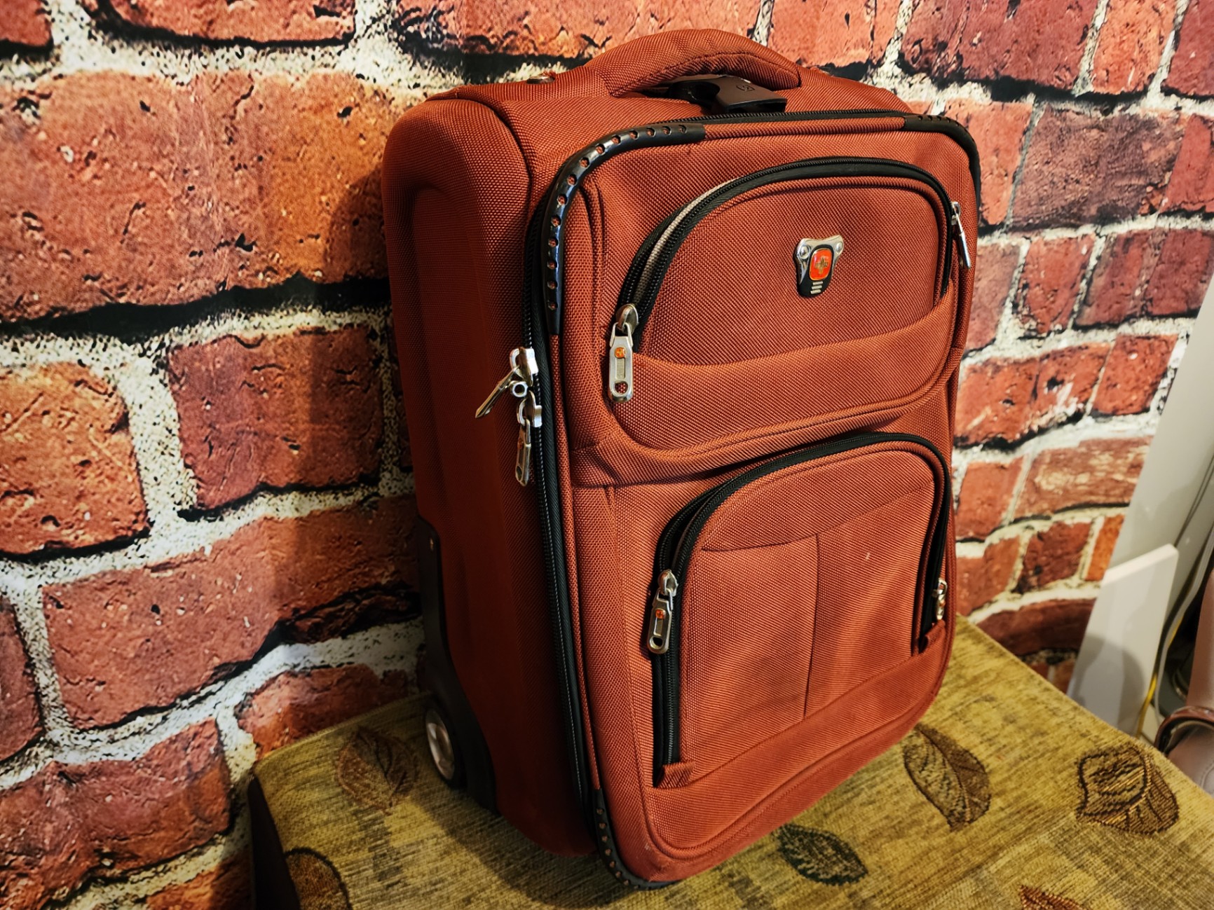 Black wheeled base, gray SwissGear red rolling suitcase - image 4 of 10