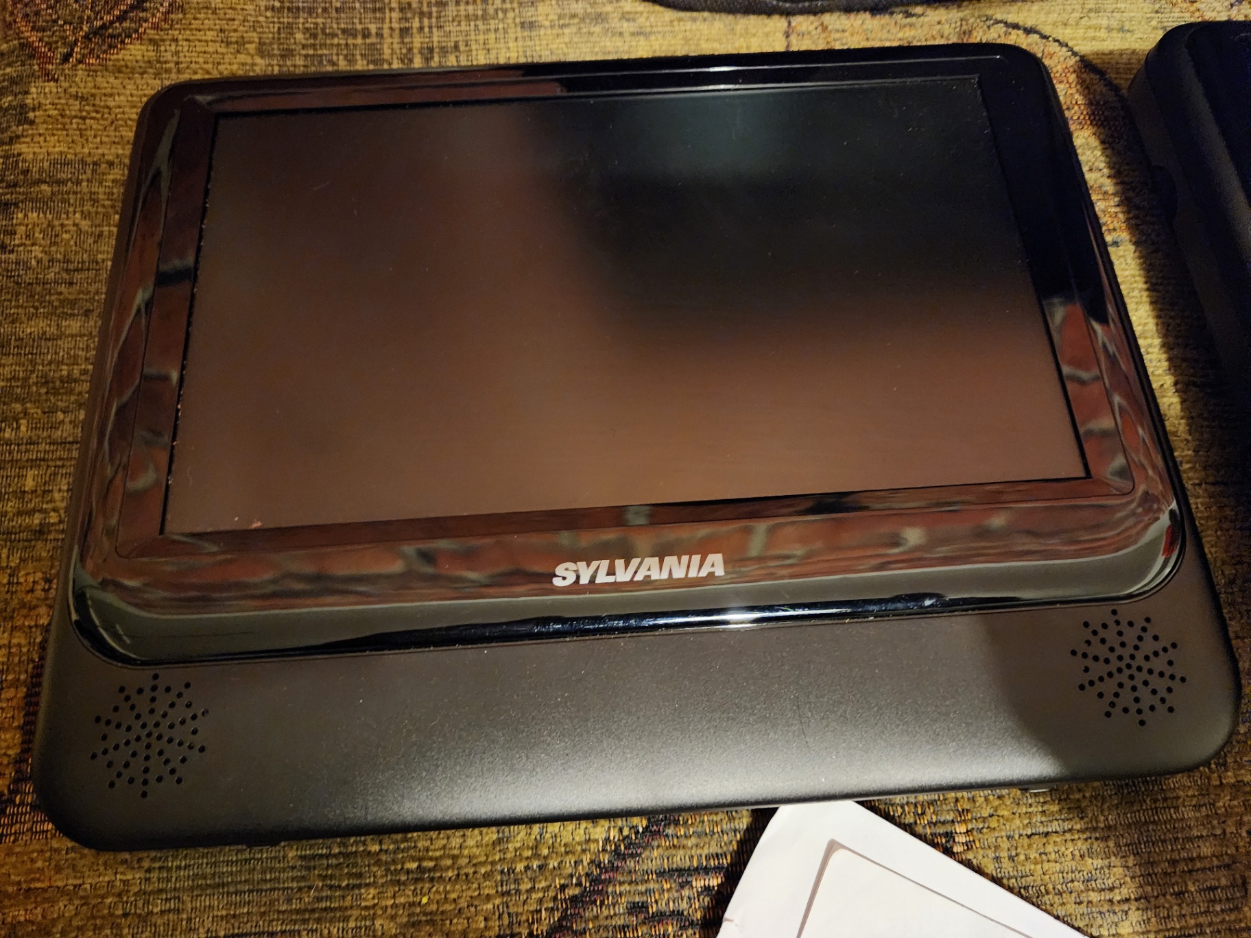 Two Sylvania portable DVD players with power adapter and manual - image 5 of 7