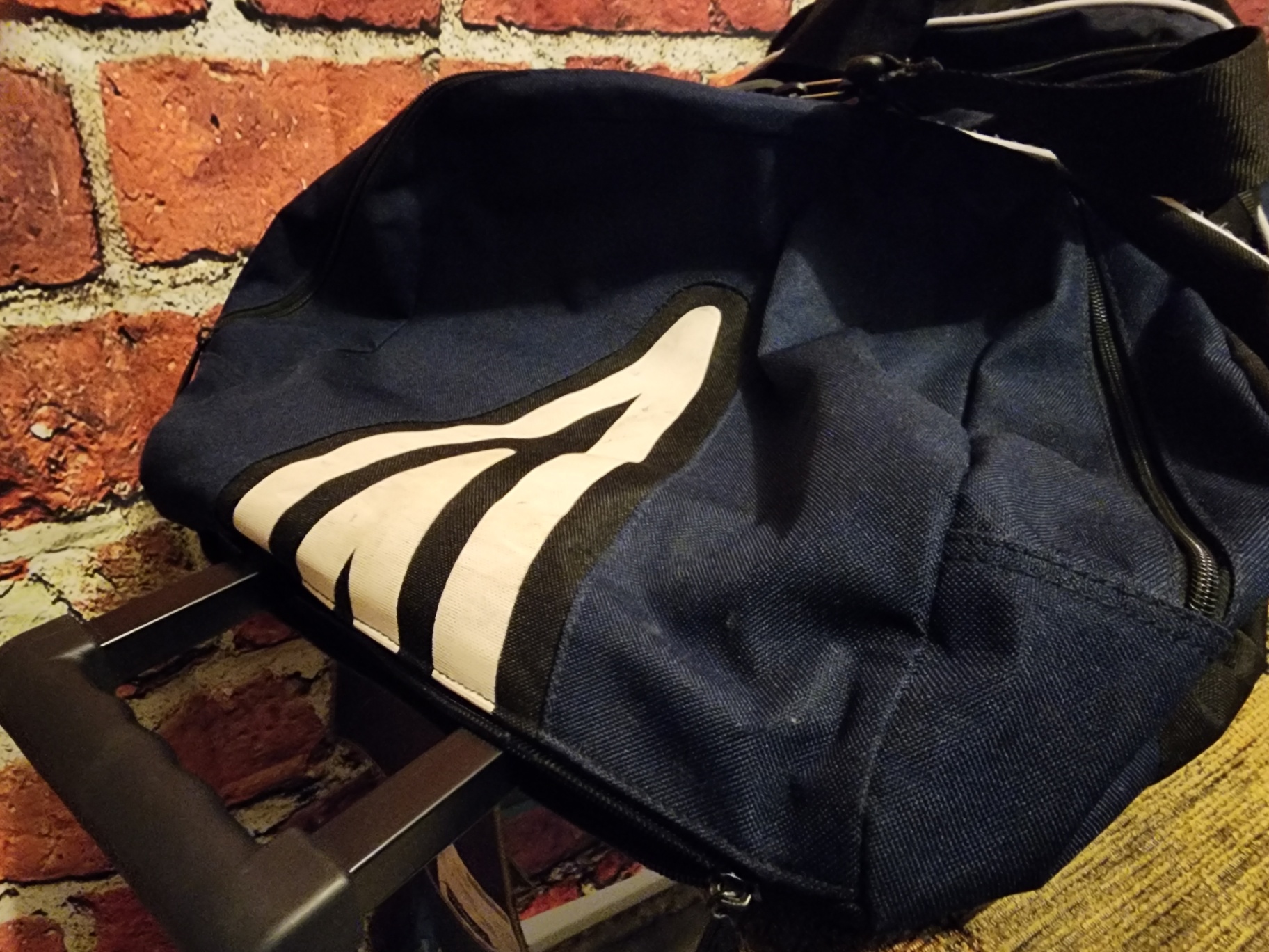 Blue Umbro duffel bag and black wheeled gear case - image 9 of 11