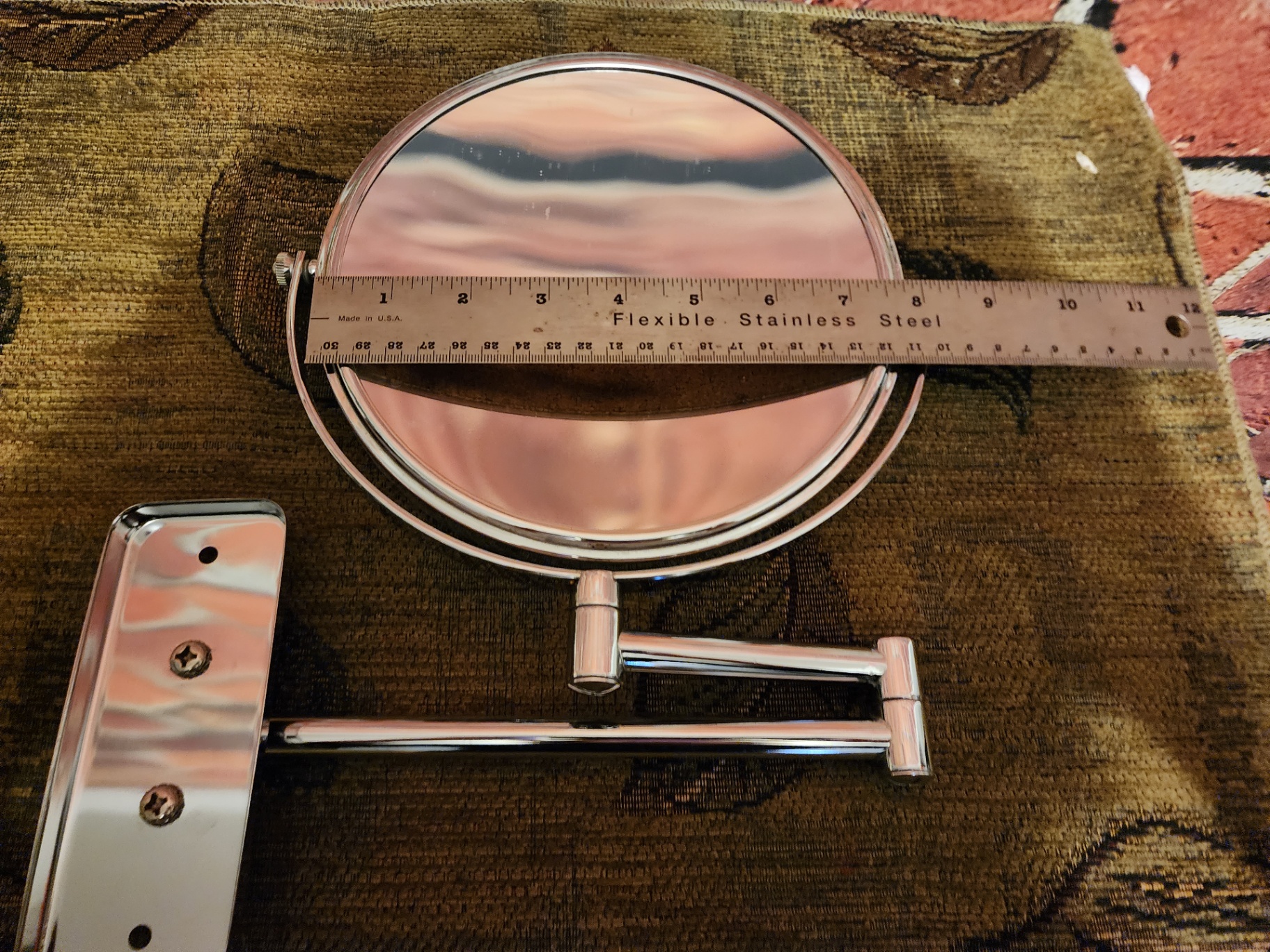 Round vanity mirror with porcelain angel figurine and decorative containers - image 1 of 8