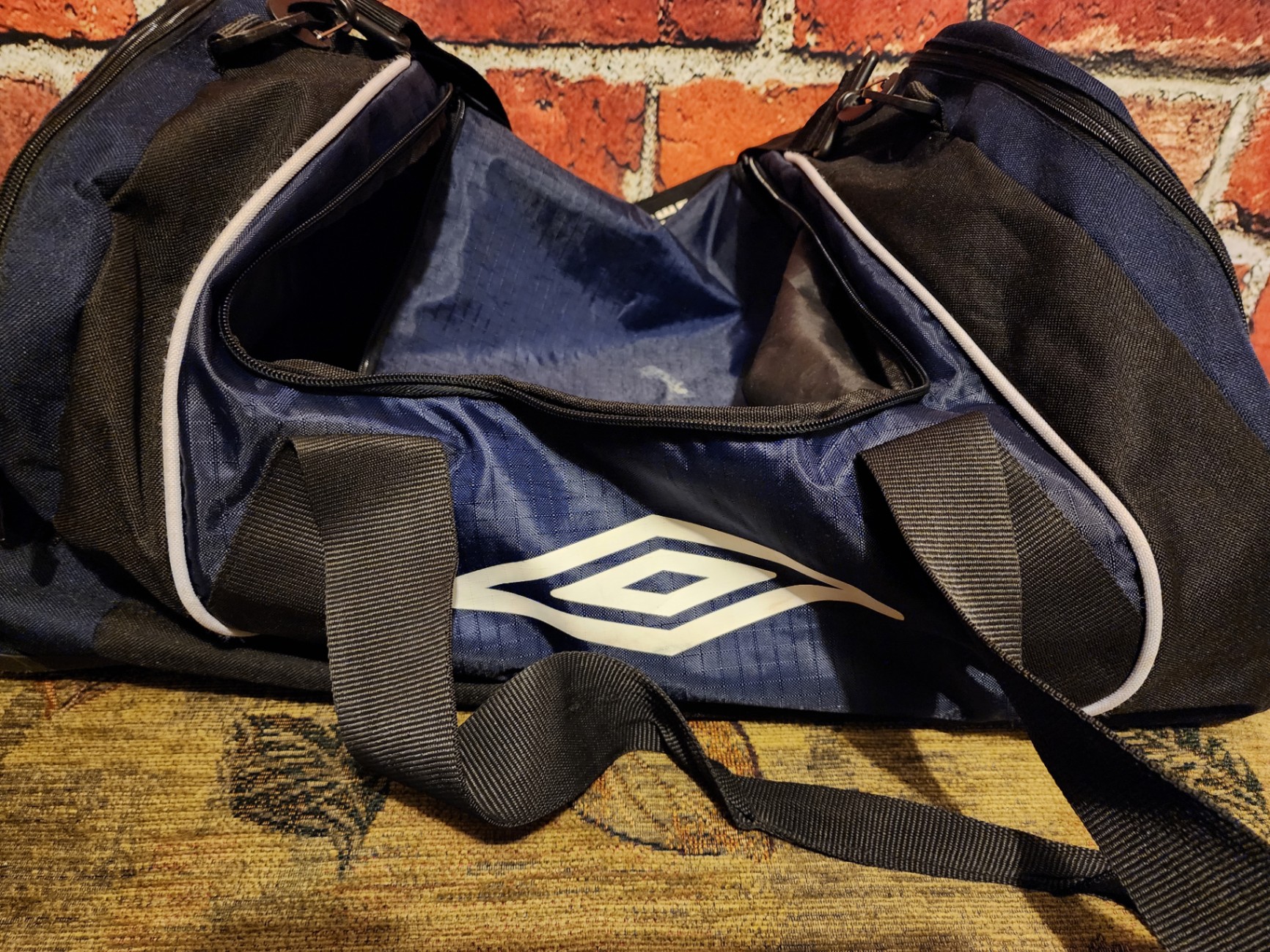 Blue Umbro duffel bag and black wheeled gear case - image 8 of 11