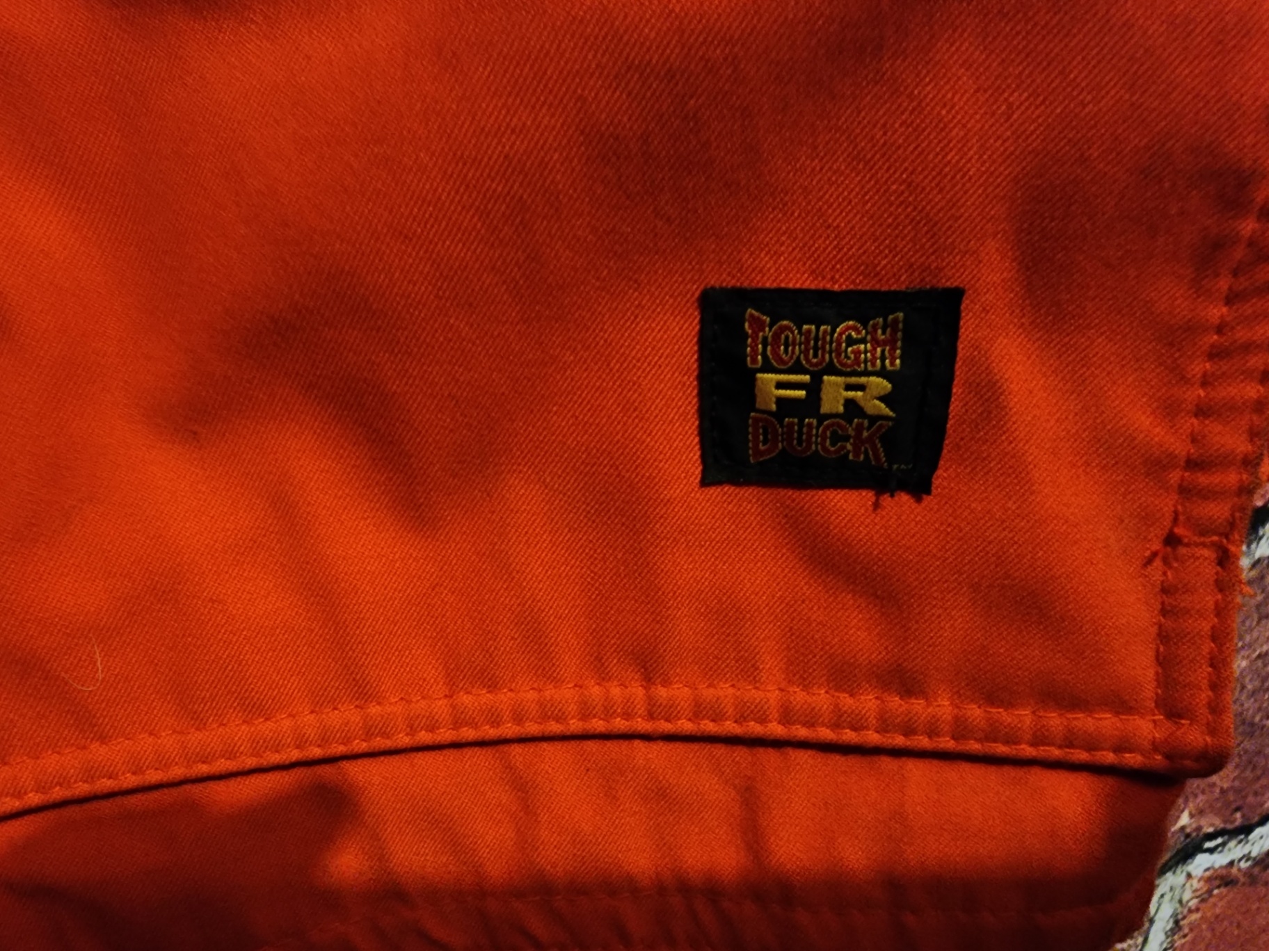 Orange high-visibility safety jacket with reflective strips - image 4 of 13
