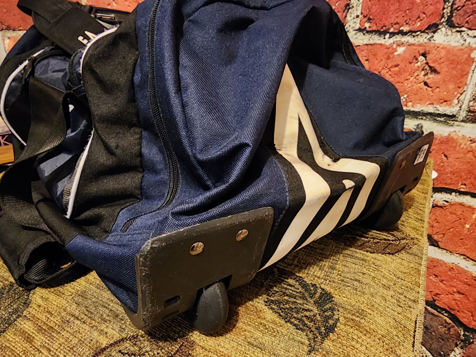 Blue Umbro duffel bag and black wheeled gear case - image 6 of 11