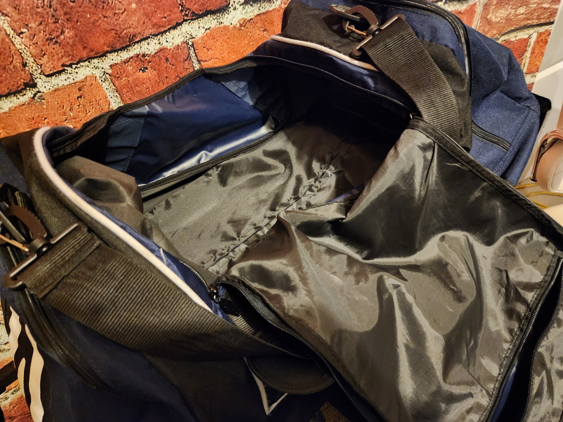 Blue Umbro duffel bag and black wheeled gear case - image 7 of 11