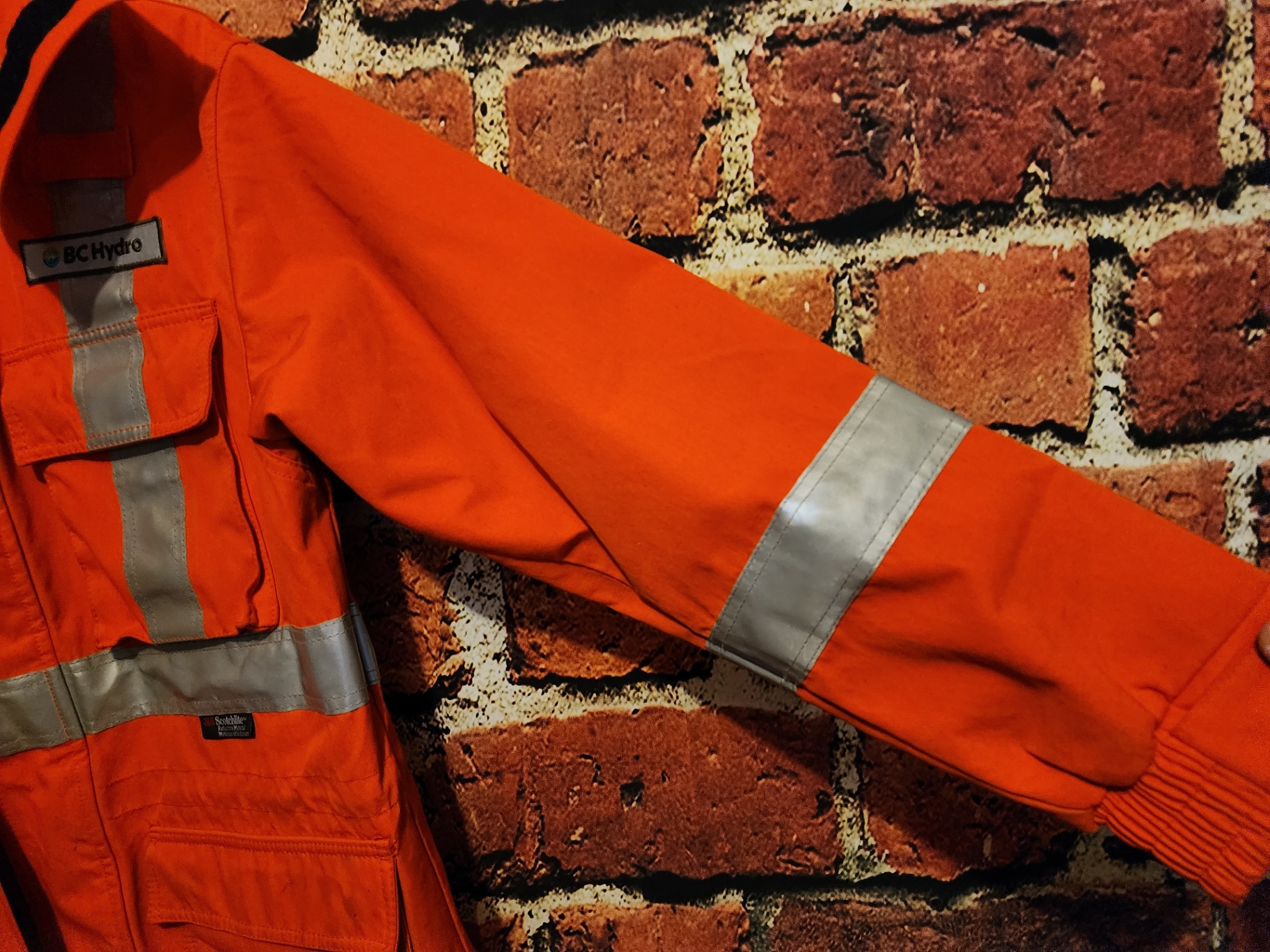 Orange high-visibility safety jacket with reflective strips - image 10 of 13