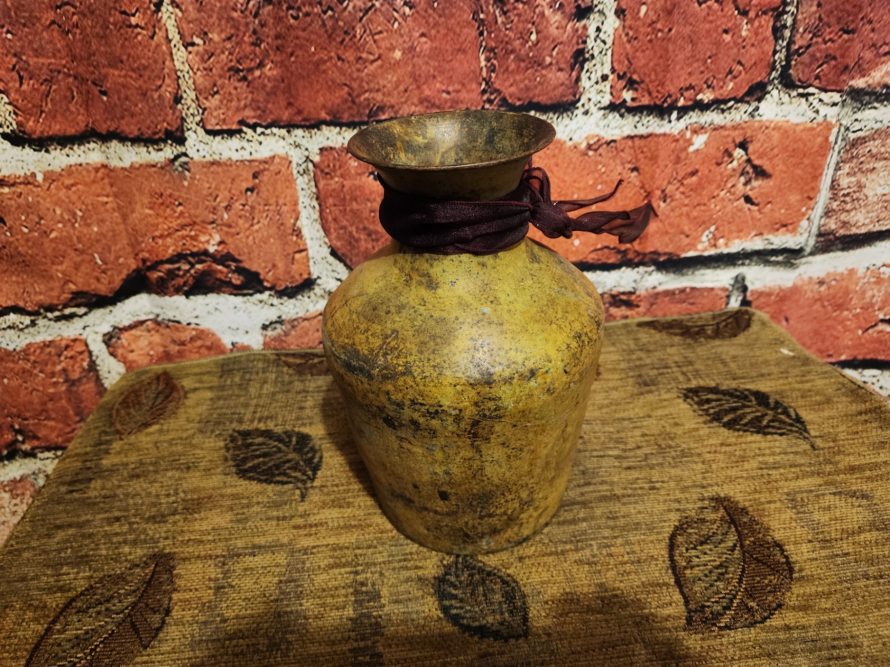Patinaed yellow vase with ribbon - image 1 of 6