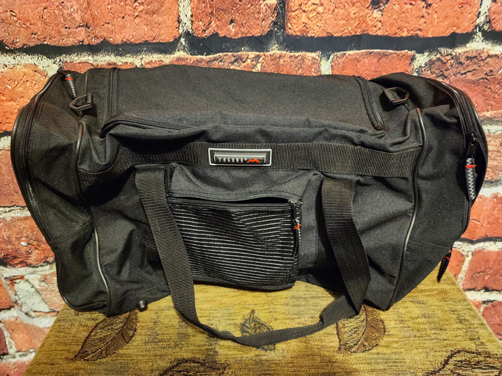 Black duffel bag with multiple pockets - image 1 of 8