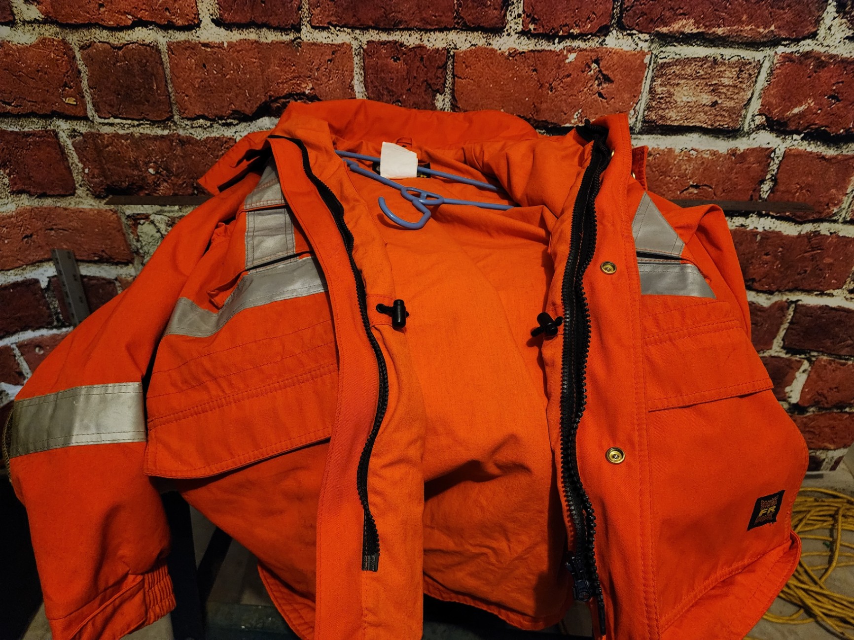 Orange high-visibility safety jacket with reflective strips - image 3 of 13