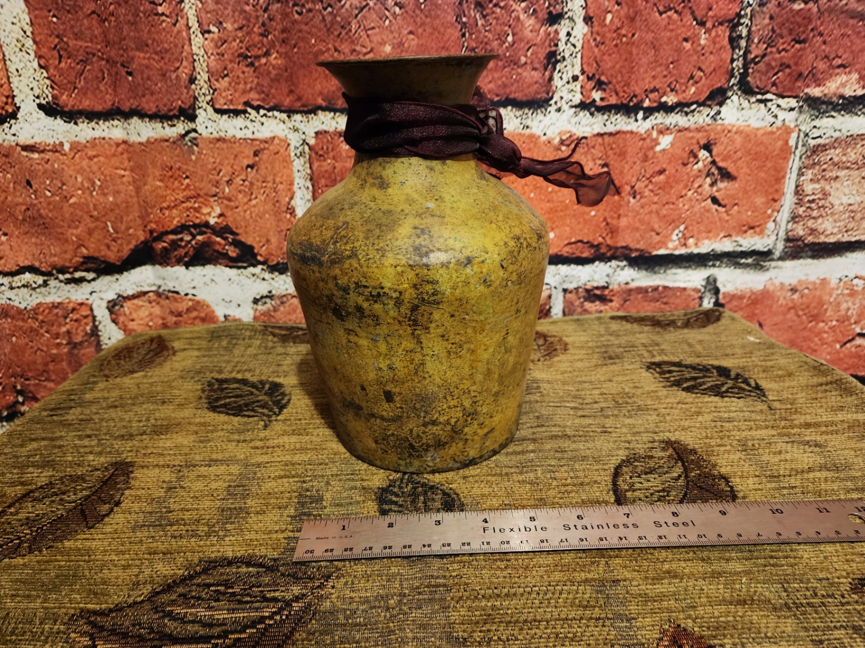 Patinaed yellow vase with ribbon - image 3 of 6