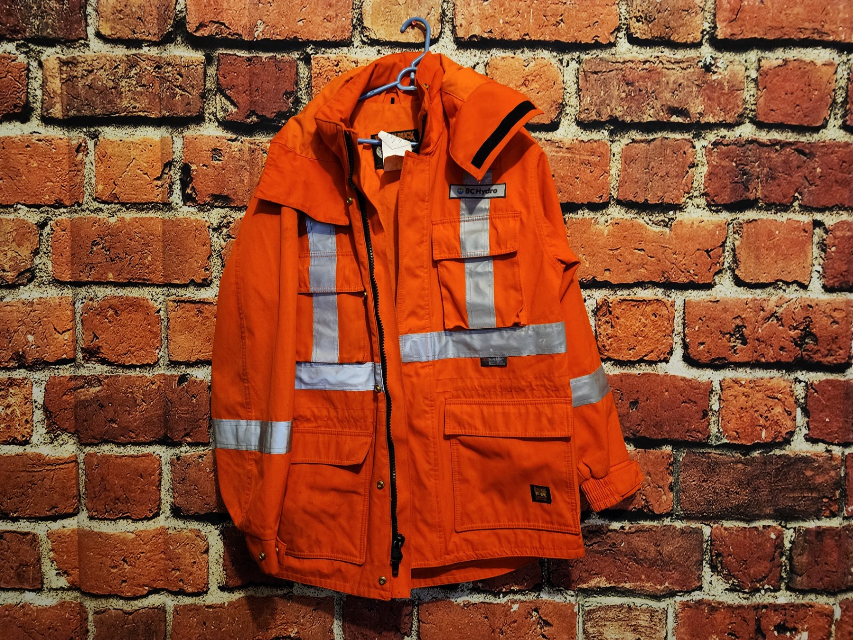 Orange high-visibility safety jacket with reflective strips - image 2 of 13