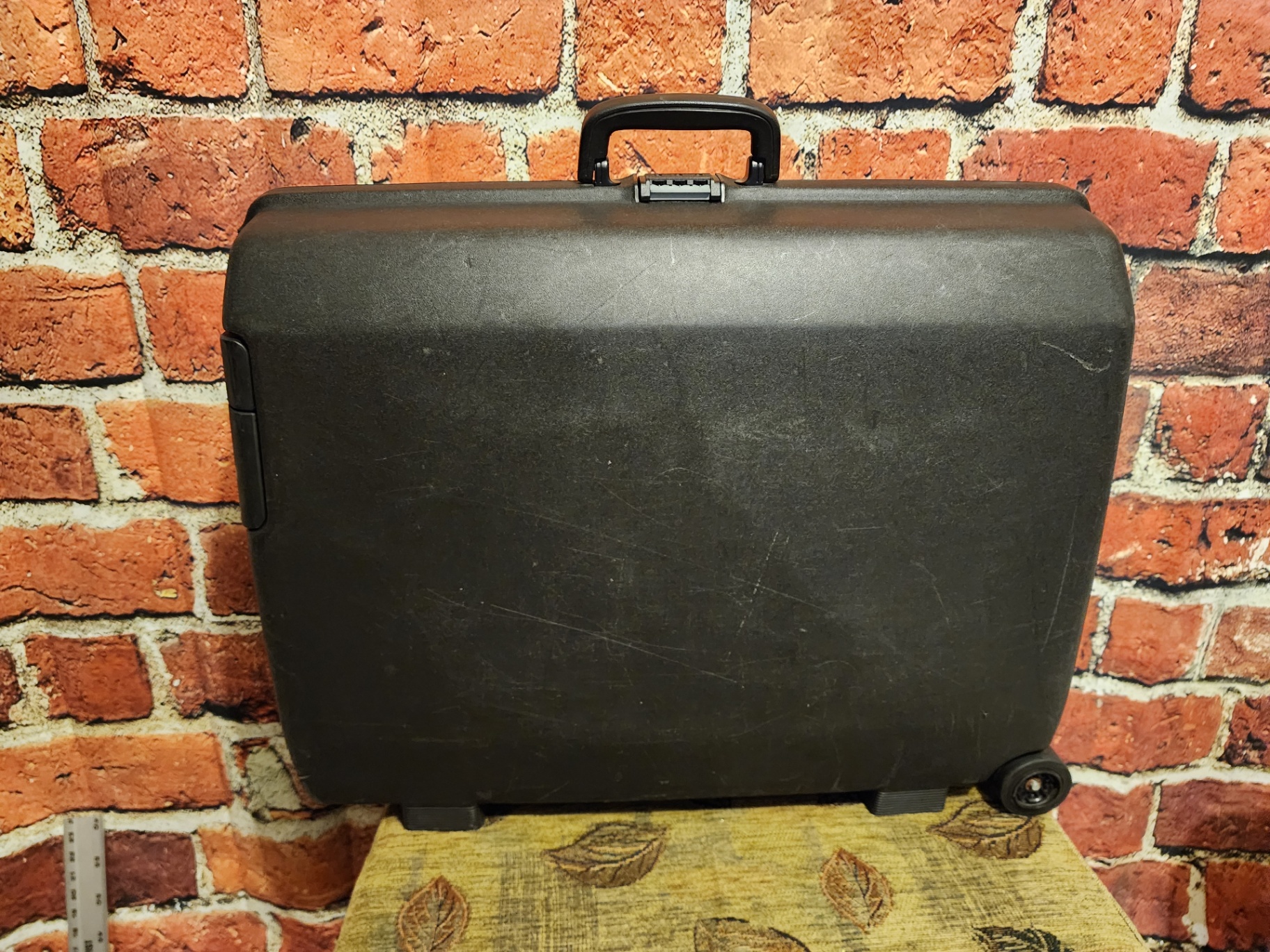 Black Samsonite hard-shell wheeled suitcase - image 1 of 11
