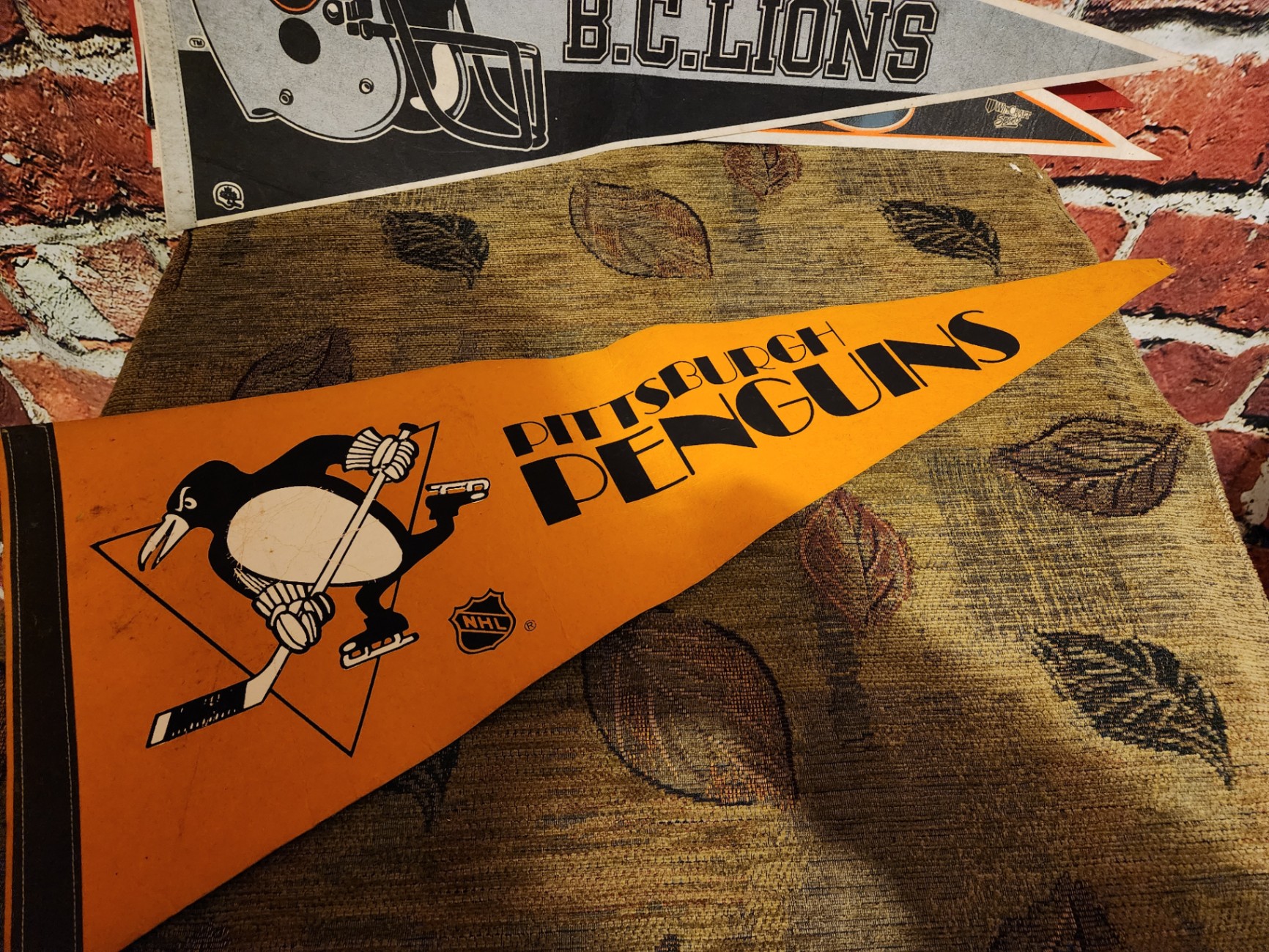 Assorted vintage sports pennants - image 1 of 16