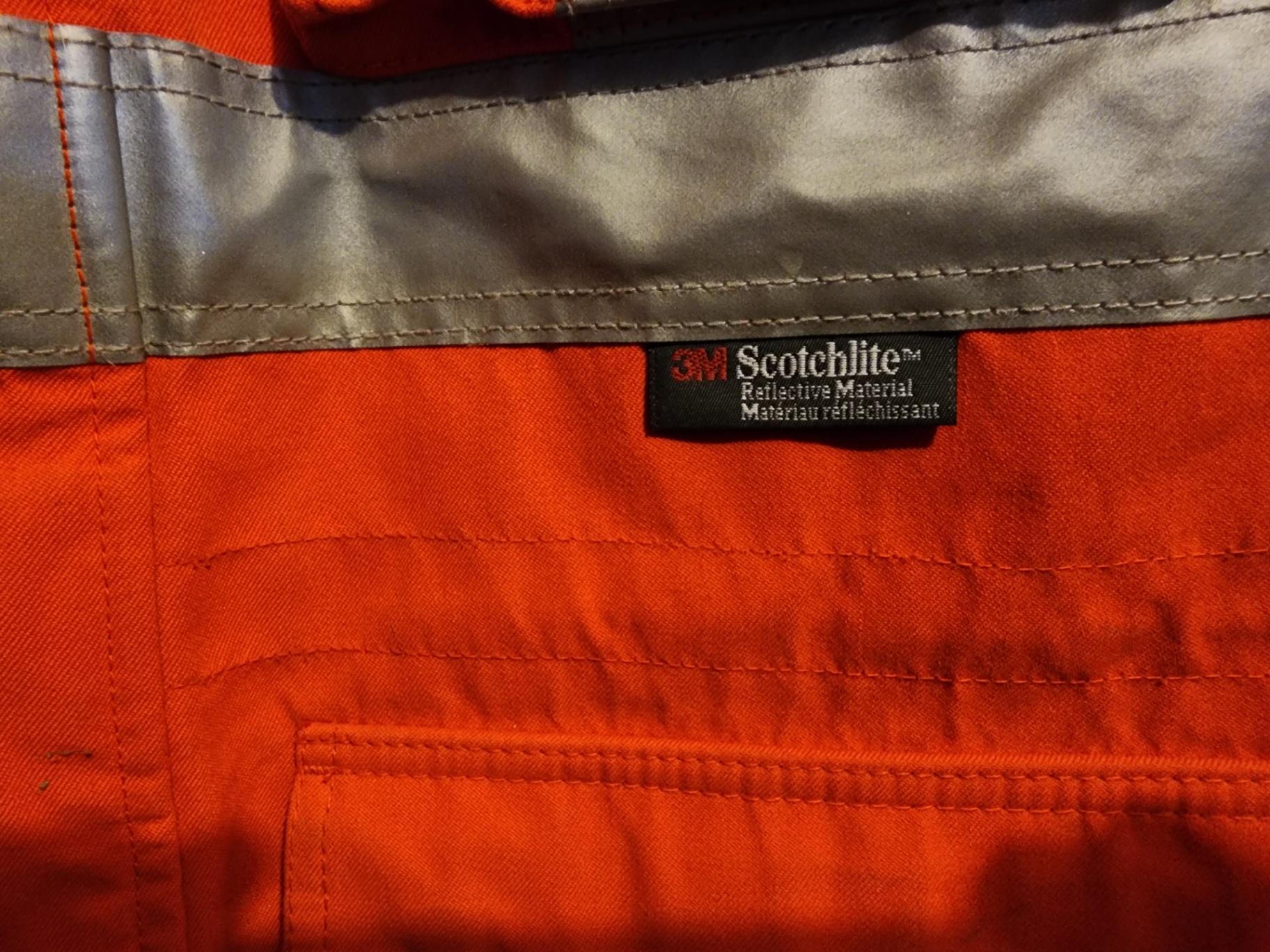 Orange high-visibility safety jacket with reflective strips - image 1 of 13
