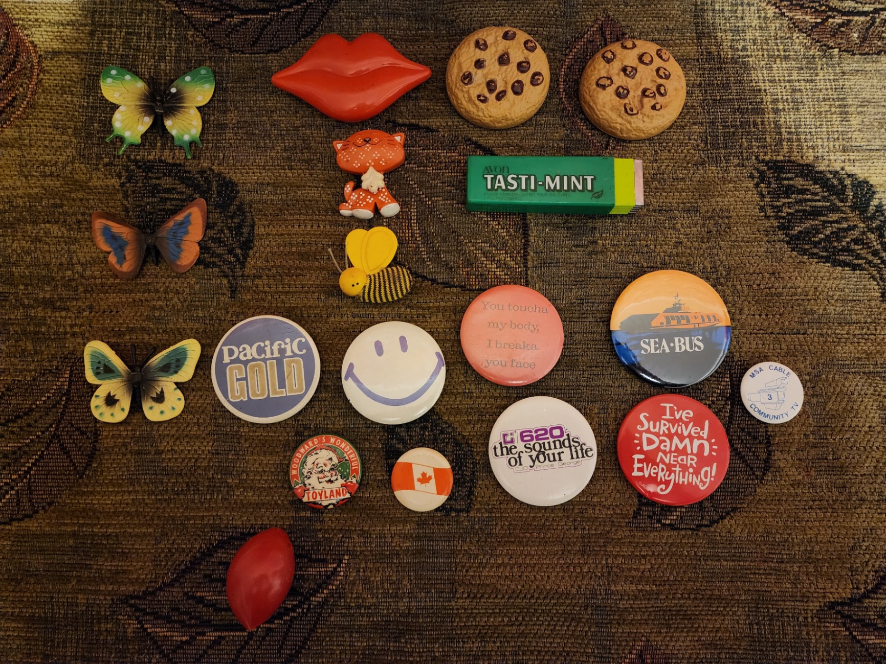 Assorted decorative pins, badges, magnets, and small trinkets - image 1 of 7