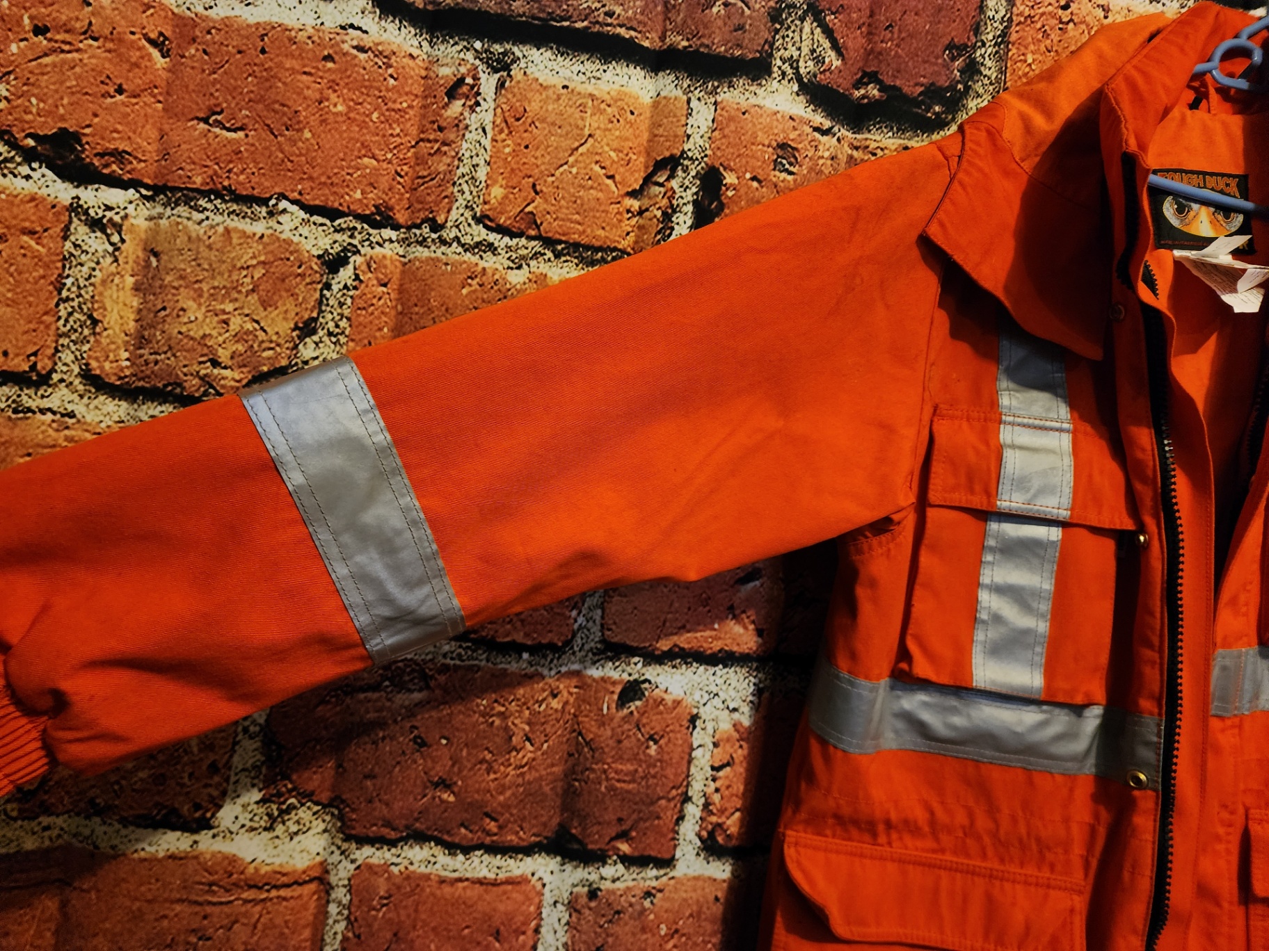 Orange high-visibility safety jacket with reflective strips - image 5 of 13