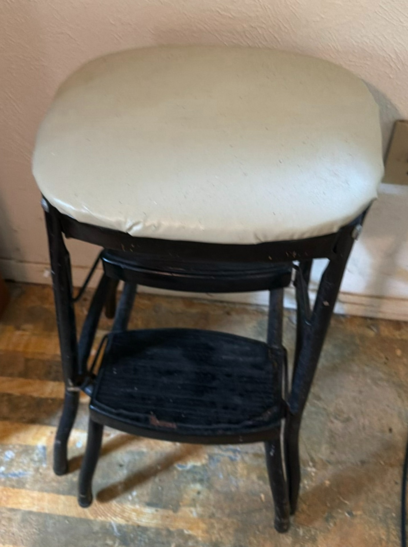 Padded black metal two-tier step stool and wooden chair with a woven seat - image 1 of 8