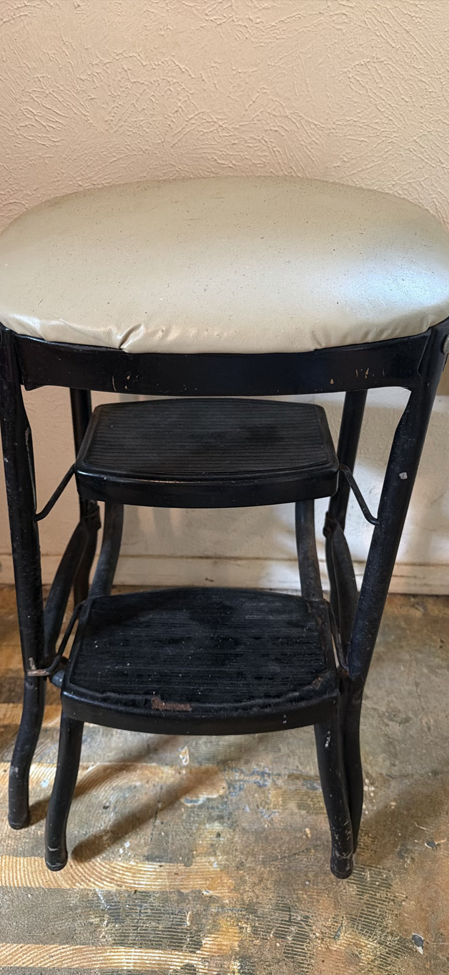 Padded black metal two-tier step stool and wooden chair with a woven seat - image 2 of 8