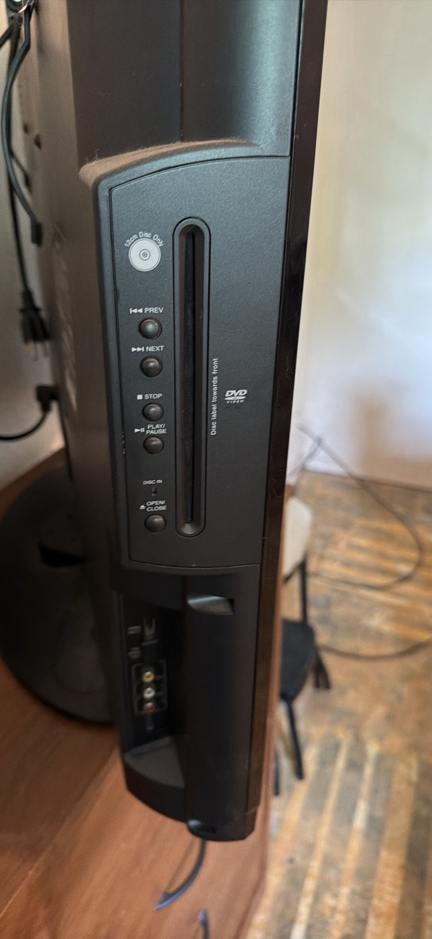 Insignia flat-screen TV with built-in DVD player on wooden dresser - image 3 of 5